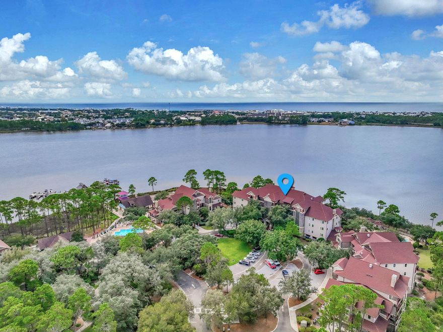 Welcome Home to your exquisite lakefront coastal oasis!  Wild Heron is the exclusive Lake Powell sanctuary for those seeking the most tranquil and beautiful lifestyle on the Emerald Coast. This top floor condo has breathtaking views of the rare coastal dune lake from the living area and the master bedroom. Enjoy al fresco dining on your spacious lakefront balcony with Lake and Gulf views. Condo was renovated in 2021 with stunning shiplap & brick walls, LPV floors, and new A/C in 2023. Enjoy all the wonderful amenities of Wild Heron including your lakefront pool and hot tub, community dock and boat slips, walking paths and nature trails, fitness center, fire pit and boathouse pavilion, boating, fishing, water sports.  Start living your DREAM where every day is a weekend! Wild Heron is a 734 acre coastal sanctuary where tranquility and natural beauty are the epitome of your daily life.  Perfectly located on the pristine shores of Lake Powell, the largest, rare coastal dune lake in the northern hemisphere, Wild Heron has unparalleled natural beauty with abundant wildlife.  206 acres are fully dedicated to conservation.  24 hour guarded entrance provides security in the rental restricted community.   The Coastal Craftsman architecture of Wild Heron has the classic finishes of river rock, stone, glass, wood, metals to preserve the natural beauty of the community.  Wild Heron has Audubon's Silver Signature status so expect to see the many beautiful birds of the area. Wild Heron is home to the renown Shark's Tooth Golf Course which is available to owners for an additional cost.    