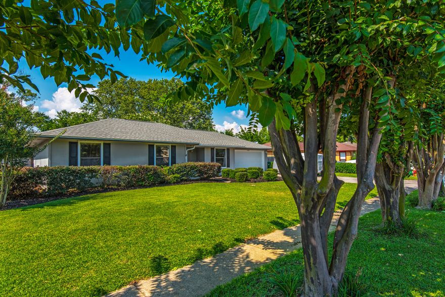 This charming home in Destin, close to beaches/shopping/schools, will greet you with beautiful landscaping in the front while the back yard has a large deck and privacy fence for entertaining. The open floor plan has bamboo wood floors throughout. Vaulted ceilings and a wood burning fire place add to the charm of the living room. The stylish new kitchen has gorgeous marble counter tops and soft close cabinets. The dining room has been converted into a 4th bedroom with one entry way enclosed with a ''secret'' bookshelf door and the other has a sliding barn door. It can be changed back into a dining room, if requested. The 2 car garage has an outdoor shower to rinse off after a day at the beach! Home is equipped with Hurricane Shutters, HVAC replaced in 2017, Flooring 2016 and kitchen 2019.