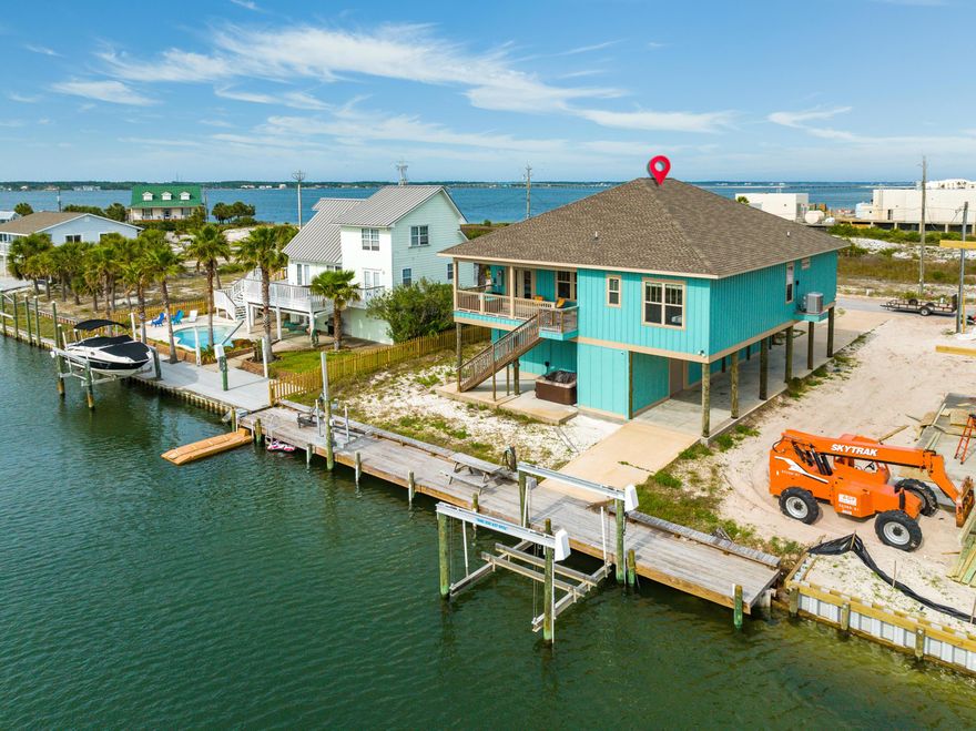 Incredible canal front home with access to the Santa Rosa Sound, a boat lift and no HOA! Being built in 2019, everything in this home is new! Upon entry you'll first notice the 12 foot ceilings in the main living and kitchen area. LVP flooring and crown molding throughout the home. In the kitchen there are top name stainless steel appliances such as Frigidaire. There is a bunk room on the right when you first walk in with plenty of room for additional configurations. To the left you'll find two guest bedrooms and a spacious full bath. In the back of the home there is an additional guest bedroom looking over the canal below and an additional full bath! The master suite is also directly on the canal and has a luxurious ensuite bath featuring dual vanities, separate tub and shower...