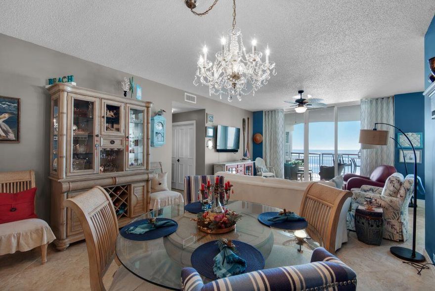 Welcome to a sun-soaked Caribbean escape- bright, playful & full of light. Every corner feels like a happy vacation, warm and welcoming, just waiting for your to settle in. Updated granite countertops and backsplash in the kitchen, plantation shutters throughout. Amazing sunset views await you on the circular terrace overlooking the Gulf. Amenities include covered parking, Olympic size swimming pool, tennis/pickle ball courts, fitness room and social center with a full kitchen for parties and entertaining. This unit is being sold fully furnished.