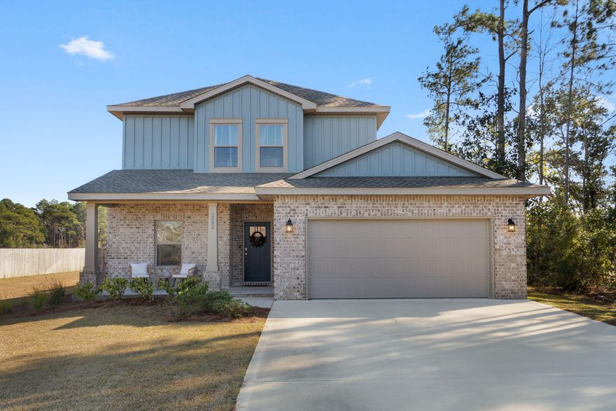 Welcome home to this exceptional and better-than-new 2023 home in Navarre, thoughtfully upgraded and ideally situated on a quiet dead-end street with a serene pasture view behind the home and no HOA! This spacious 4-bedroom, 3-bath residence offers 2,327 square feet of well-designed living space and timeless curb appeal with brick and cement fiber board construction, architectural shingle roof, sprinkler system, and a fully fenced backyard. Inside, enjoy luxury vinyl plank flooring throughout first-floor common areas, neutral tile in the bathrooms and laundry room, and plush carpet in the bedrooms. Elegant details include crown molding and tray ceiling accents in the living room, dining room, and first-floor owner's suite. The open kitchen is a showstopper with stainless steel appliances, shaker-style cabinetry, upgraded quartz countertops, designer tile backsplash, and a spacious walk-in pantry. The first-floor owner's suite is a true retreat, featuring peaceful backyard views and a spa-like en suite bath with a walk-in tiled shower with glass door, separate soaking tub, double granite vanities with upgraded mirrors and lighting, and an oversized walk-in closet with direct access to the interior laundry room. An additional bedroom and full bath are also located on the first level! Upstairs, you'll find two generously sized bedrooms and a full bath with extra matching cabinet storage. Outdoor living is equally impressive with both a screened-in front porch and a large extended back patio spanning the width of the home, ideal for relaxing or entertaining within your fenced in and private backyard. Welcome home to comfort, quality, and peaceful views - all in a nearly new Navarre home.