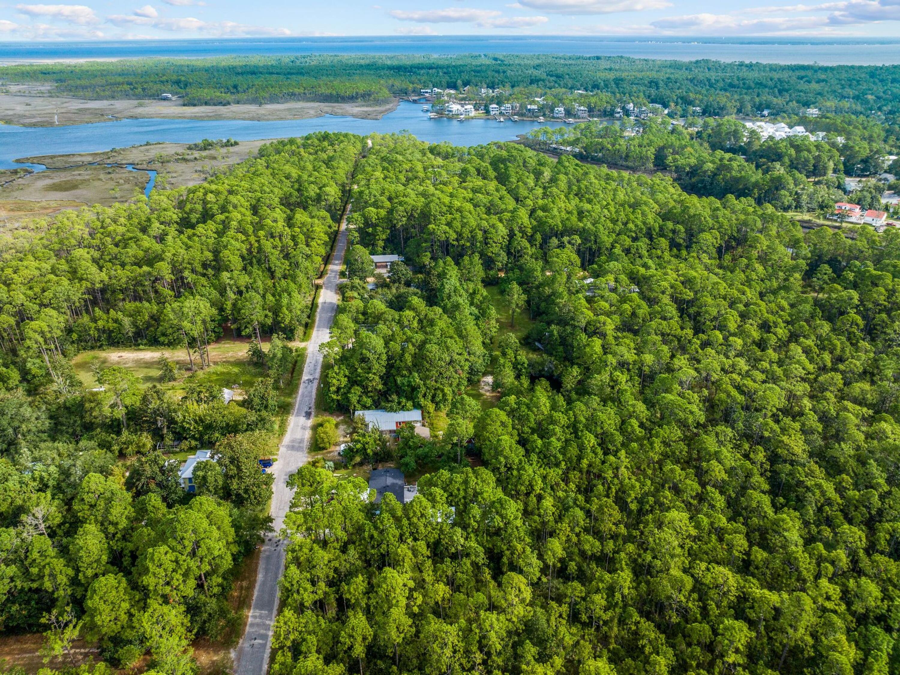 Discover an exceptional opportunity to build your dream home or investment property on these two spacious vacant lots in north Santa Rosa Beach. Located on 13th Street, these lots offer the perfect blend of privacy and convenience, with an enviable location just a short walk from the serene waters of the Bay. Whether you envision a custom-built private residence or a profitable development, these lots provide ample space and flexibility for your plans. With 10 additional feet of depth compared to standard lots in the area, these parcels allow for larger footprints and greater design possibilities. In addition, there are no wetlands on these lots. Just a 10-minute ride to the stunning beaches of 30A and a five-minute drive to the vibrant restaurant and retail scene on Highway 98, these lots are ideally positioned for both relaxation and accessibility. Adjacent to another listing at 300 13th Street, these 11 additional lots can be purchased together to create a truly expansive property. Perfect for investors, developers or buyers seeking a slice of paradise to call their own, this opportunity offers endless potential in one of the most desirable areas along the Emerald Coast.