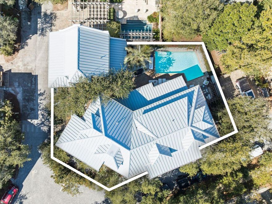 Positioned just 100 steps from the sugar white sands and emerald waters of the Gulf, 216 Round Road offers a rare opportunity to own a fully renovated and designer furnished estate in the heart of Rosemary Beach. Set on one of the community's most private corner lots facing a beautiful park, this Mediterranean inspired coastal residence blends timeless architecture with elevated modern updates, creating a home that is both refined and welcoming.Spanning three levels in the main residence plus a beautifully updated carriage house, the property has undergone extensive renovations in 2022 through 2025. A grand mahogany entry door opens to a dramatic great room featuring pecky cypress ceilings, Venetian plaster walls, and an open concept layout designed for seamless entertaining. Refinished 100 year heart pine floors run throughout the main house and carriage house, complemented by new lighting.
The fully remodeled chef's kitchen is outfitted with premium appliances including a 48 inch Wolf six burner gas range with pizza oven and griddle, SubZero 42 inch refrigerator, SubZero wine chiller and ice maker, dual KitchenAid dishwashers, Native Trails stone sinks, and Cambria quartz waterfall countertops. 
The primary suite serves as a private retreat with spa inspired his and hers baths featuring new quartzite counters, custom vanities, upgraded Kohler and Delta fixtures, steam and Jacuzzi elements, Italian terrazzo flooring, designer Italian and Swedish wallpaper, and custom shower doors. Additional baths have been thoughtfully updated with elevated tile selections and premium finishes.
The flexible floor plan offers multiple guest suites and a third level designed for family living with bunk rooms, lounge space and a working desk area. Outdoor living is exceptional, with covered loggias, alfresco dining spaces, and a heated pool. A complete backyard transformation is currently underway, featuring white stone pavers, new pool coping, and refreshed surrounding spaces, serving as the final update in the thoughtful evolution of this remarkable home.
The carriage house has been fully refreshed with new cabinets, counters, appliances, offering ideal accommodations for guests or rental flexibility.
Offered fully furnished with curated interiors by Tracery, Beau Interiors, Not Too Shabby, Hunter Douglas, and Restoration Hardware, this home delivers a sophisticated yet relaxed coastal aesthetic.
Rosemary Beach is renowned for its cobblestone streets, iconic architecture, and walkable town center filled with award winning dining, boutique shopping, and year-round events. Residents and guests enjoy private beach access, multiple resort style pools, clay tennis courts, parks, and an unmatched sense of community along Scenic Highway 30A.
With the Gulf just outside your door and every detail thoughtfully completed, 216 Round Road represents turnkey luxury living in one of the most sought after beach communities in the country.
