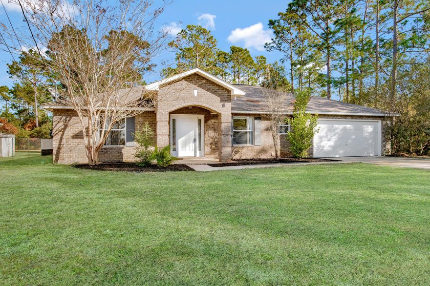 Situated on a cul-de-sac in Holley By The Sea, this home offers 4 bedrooms and 3 full bathrooms with an open spacious floor plan with vaulted ceilings and a formal dining room and formal sitting room. The formal sitting room would also make for a great home office space, playroom or home gym. You'll enjoy the secluded shady backyard (lot goes back 300 feet with wooded area). The entire interior including trim and doors have been freshly painted with new vinyl plank flooring throughout the main living areas and bathrooms. The kitchen has an island with breakfast bar, breakfast nook and stainless steel appliances with a large pantry. Just off the pantry is an oversized laundry room with a utility sink. The master suite offers privacy located on the opposite side of the house from the additio