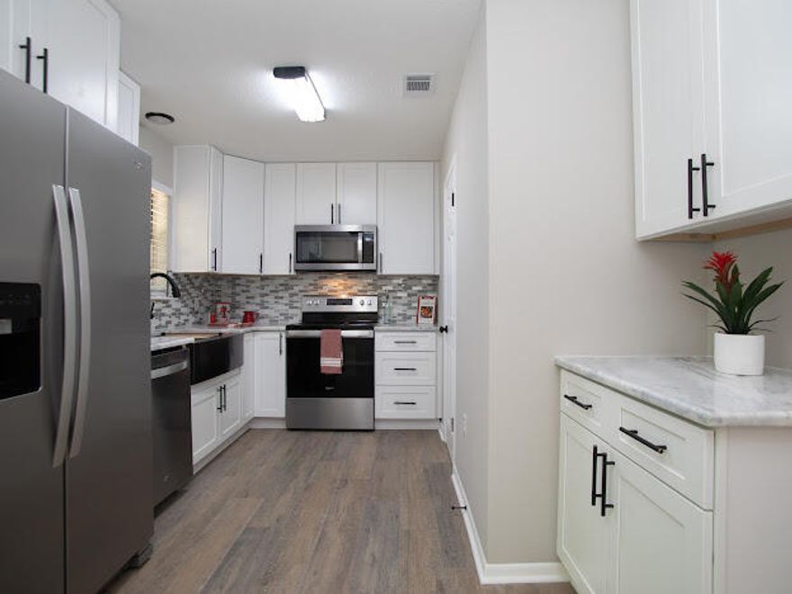 100% Redone! 100% Move In Ready! 3 BD 2 B, Home completely updated. New Kitchen Cabinets, Granite Counter-tops, New Backsplash, New Stainless steel appliances, Lights & Sink. New flooring throughout home with Laminate in main areas, Luxury Vinyl in baths and Carpet in bedrooms. New Vanities in baths, lights, mirrors, Tub with new tile one bath, New shower/tile 2nd bath. New fans and lights, New paint inside & out. Has copper wiring....Roof 2012 approx., HVAC 2017 and Hot Water Heater 2015. Room sizes approx. buyer to confirm.