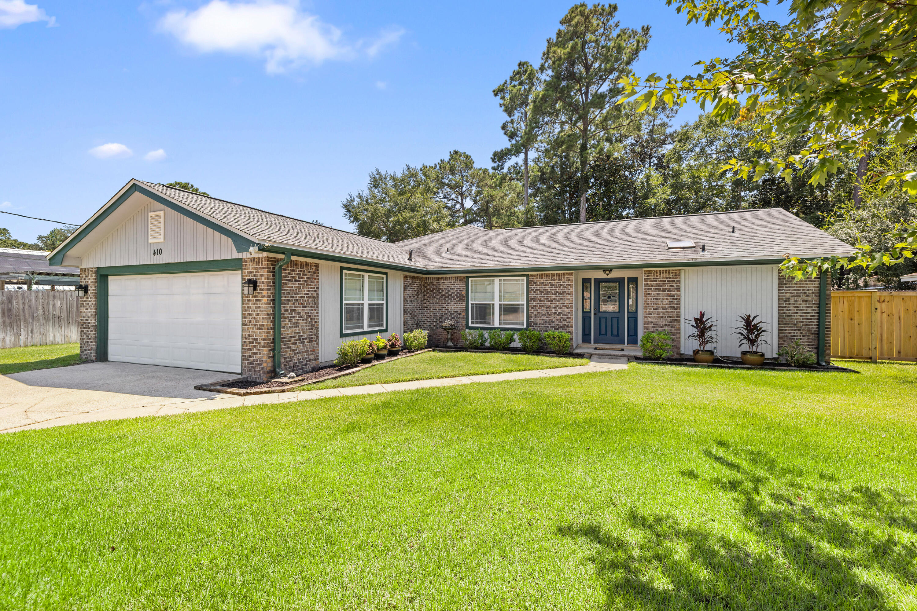 Welcome to 410 Green Oak Ln -- a 3-bed, 2-bath, 1,887-sq-ft home on a quiet loop just off Bayshore. Enjoy bright open living spaces, a functional split-bedroom layout, and a screened porch perfect for lazy mornings or breezy evenings. The fenced backyard has room for real life, grilling, gardening, or weekend get-togethers. Lions Park boat ramp and Turkey Creek boardwalk are minutes away, plus you're in the sought-after Plew/Ruckel/Niceville school zone with an easy commute to Eglin AFB. If you've been looking for single-level comfort, water-adjacent lifestyle, and a neighborhood locals love, this one checks the boxes.
