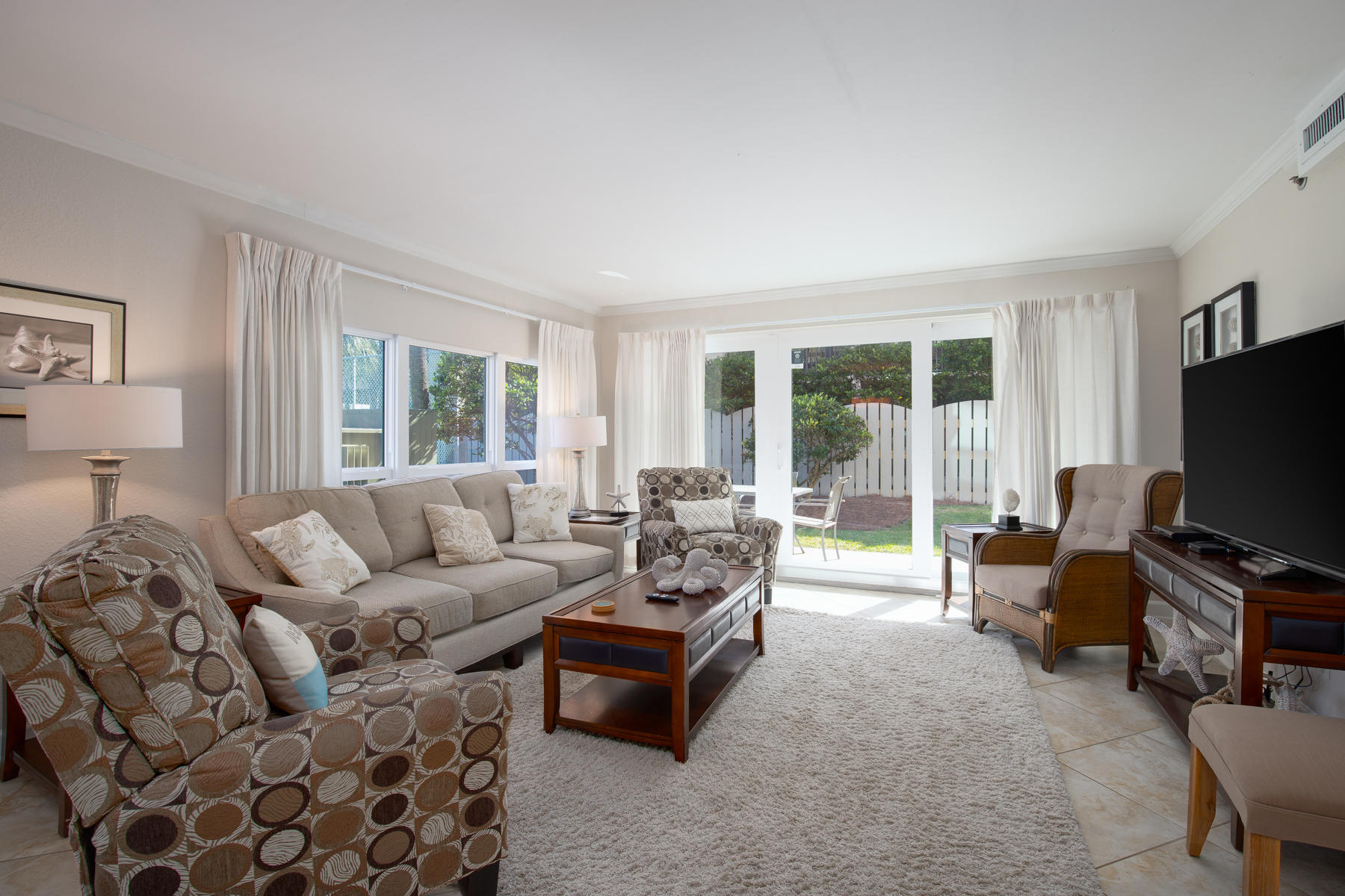 Escape to the emerald green waters and white sand on Okaloosa Island! This Sea Oats condo lives large and has a brand new AC! It is a corner 3 bedroom/2 bath condo with lots of windows to let in the light! The first floor, walk up location means no elevators and is great for kids as well as owners with pets. Modern dcor, all tile with beautiful granite and stainless in the kitchen. Featured is a private covered patio with a yard right outside the door. Sea Oats complex has been recently remodeled with new exterior paint, walkways, balconies, windows and doors. Amenities include a seasonal heated pool, hot tub, spacious poolside deck, grills, tennis courts and of course a beach walk over.