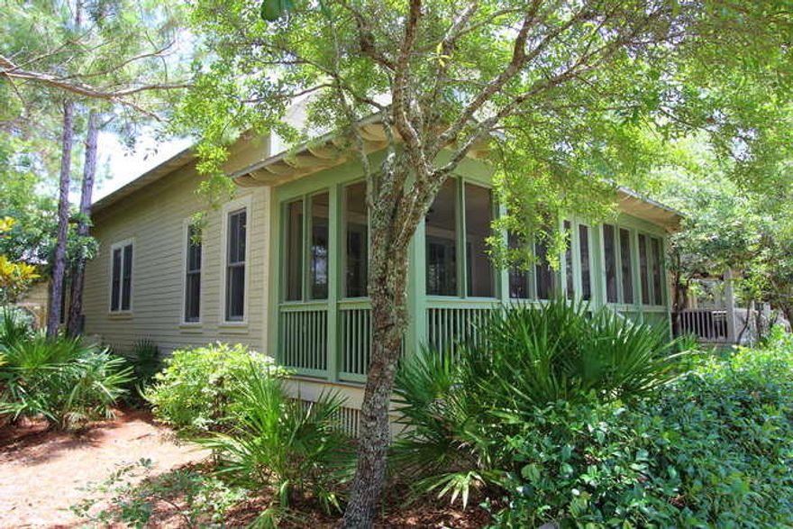 Perfect cozy cottage for a small family. The wide screened porch has room for two seating areas and overlooks a quiet section of Red Cedar Way. Open living, kitchen and dining area. Honed granite counters and JennAir/Subzero appliance in kitchen with breakfast bar. First floor master with large walk-in closet, large adjoining bath. Upstairs are two additional bedrooms with two hallway bunks. The carriage house has a large living/dining and kitchen area with a separate bedroom. Three covered parking spaces beneath carriage house. One owner and never rented - in great condition!