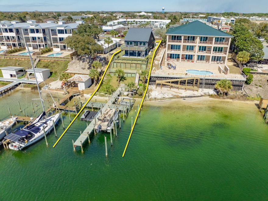 SIGNIFICANT PRICE REDUCTION!!  NO HOA! DUPLEX on the SCENIC HARBOR in Destin, Florida! NO HOA! ENTIRELY GUT-RENOVATED duplex featuring two enormous, DEEP-WATER BOAT SLIPS and a 100% new dock, deck, pier, and pilings. The entire duplex (first and second floor units) and its two homes incorporate the latest features, finishes, and building technologies pursuant to the current building codes. The new cutting-edge ES windows and doors contain impact-resistant glass throughout. Both homes contain new 'whole house' generators. The second floor features a vaulted ceiling, loft with bunks, two large bedrooms and two bathrooms, and an abundance of closet space. The... ...second-floor deck is custom-milled from Ipe and is beautifully installed through its concealed fastening system.  The custom tempered glass balustrade that surrounds the expansive deck allows for unobstructed fabulous view corridors of the scenic harbor and Gulf of Mexico. A custom-fabricated aluminum spiral staircase allows for access from the upper deck to the first-floor concrete patio. The first-floor features two large bedrooms and two bathrooms, also an abundance of closet space. The concrete floors on the rear patio and garage have been finished with a superior epoxy coating applied by Ninja Coatings. Both units feature all new spray foam insulation on all exterior walls and under the decking of the new standing seam metal roof, resulting in significant utility cost savings. Both units contain all new drywall, flooring, bathrooms, kitchens, appliances, fixturing, wiring, cabling, plumbing, etc...Fiber optics is wired throughout, and high-tech security cameras surround the entire exterior structure, recording all activity in 4K high resolution. Low voltage wiring was also installed for custom window treatments resulting in the utmost privacy when desired. The new gutters are custom fabricated by a German-manufacturer. Culligan has installed a water filtration system, which services both homes. A new well and pump has been installed to irrigate the landscape. The new Carrier HVAC systems are also accompanied by all new ductwork throughout. Two exterior mounted, new gas tankless hot water systems replaced the outdated interior hot water tanks. There are (16) gas lanterns surrounding the exterior that display fabulous ambiance. The enormous garage is climate controlled but is not calculated in the approximate 3,500 square foot of conditioned interior living square footage that is identified in this listing. The new custom garage doors are insulated with new side-mounted openers. The garage door tracks have been powder coated white. Both sides of the garage have been pre-wired for electric car charging. The deepwater boat slips measure approximately 18.5' x over 50' and 14.5' x over 50'. All improvements involved permitting and approvals through the City of Destin, with the design and reconstruction by a Licensed Architect, Engineer, and General Contractor. Please inquire for further details and to schedule a private showing. All showings require a minimum of (24)-hours of advanced notice and the listing broker must accompany all showings. No trespassing shall be permitted. MatterPort [approximate] floor plan(s) are uploaded to this list under the 'Documents' tab. Interior images shall be available by March 15, 2025.