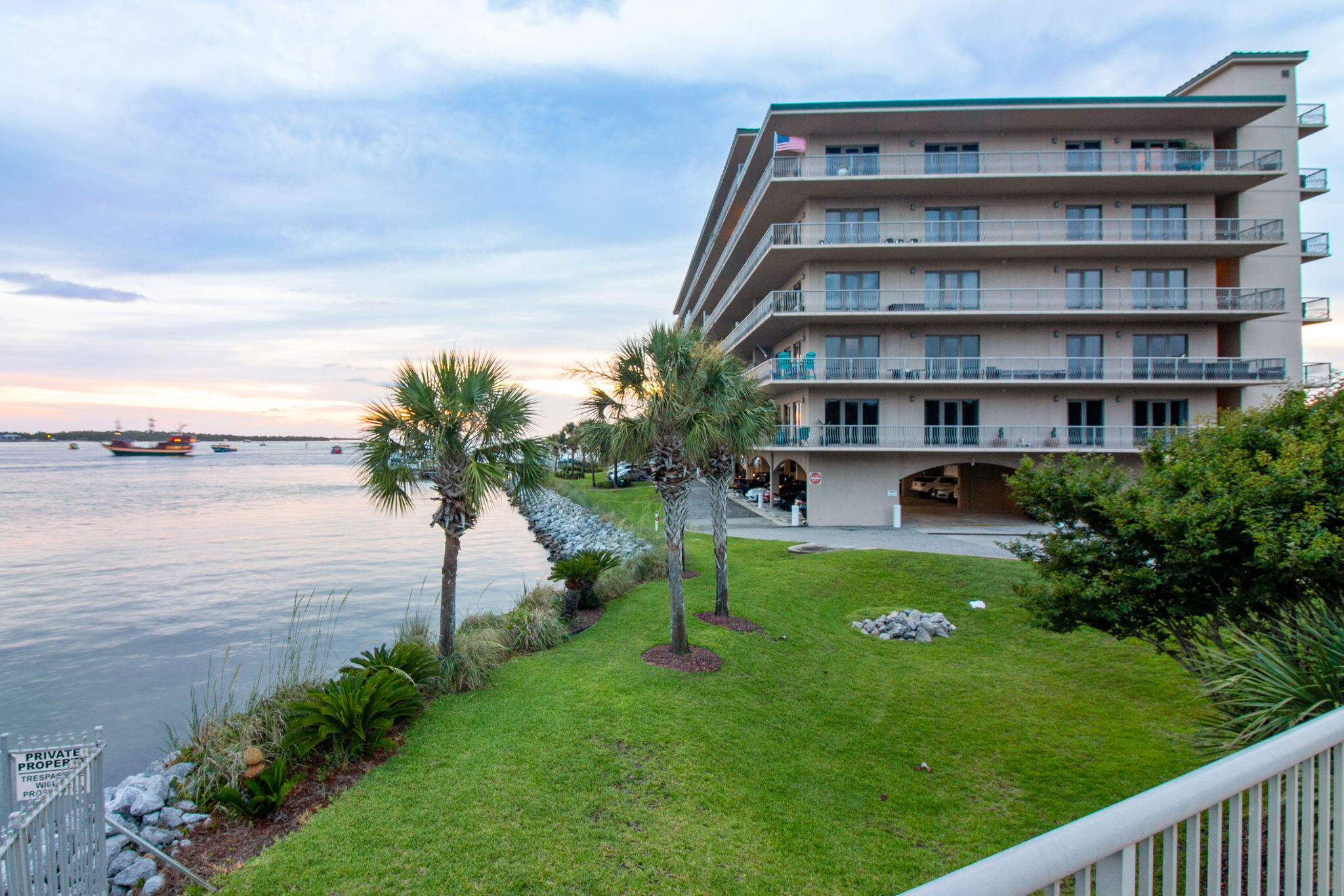 This nicely furnished 3 bedroom, and 3 bath condo has breathtaking views of the Destin East Pass and Crab Island, as well as front row seats to the Destin Harbor fireworks shows. Enjoy gorgeous sunsets & swimming dolphins from your large, covered balcony. This condo is located in a gated complex. The interior features crown molding, raised ceilings, recessed lighting, Corian counter tops, refrigerator with ice & water in door, double oven & a wet bar. Grand primary suite features a large walk-in closet, dual vanity sinks, a separate shower, jacuzzi tub, gorgeous water views & has access to the covered balcony (also accessible from the living room). The unit comes with 1 assigned garage parking space, and a community pool that overlooks crab
