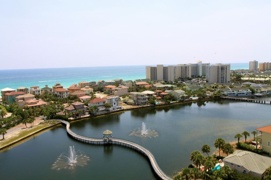 The Terrace at Pelican Beach Resort offers a fantastic second home or vacation rental. Settle in and relax to enjoy the sparkling views of the Emerald Coast while overlooking the picturesque pond and it's fountains. The Terrace is perfectly located to provide unique views that reach as far as the Destin Bridge and harbor front, making sunsets and firework shows part of it's many benefits.Enjoy convenient access to The Pelican's private beach just minutes from the Terrace. Tram Service is provided Seasonally.Attractively furnished, this two bedroom and two bathroom lake front condo has an open living area with large sliding glass doors allowing envious amounts of natural light.