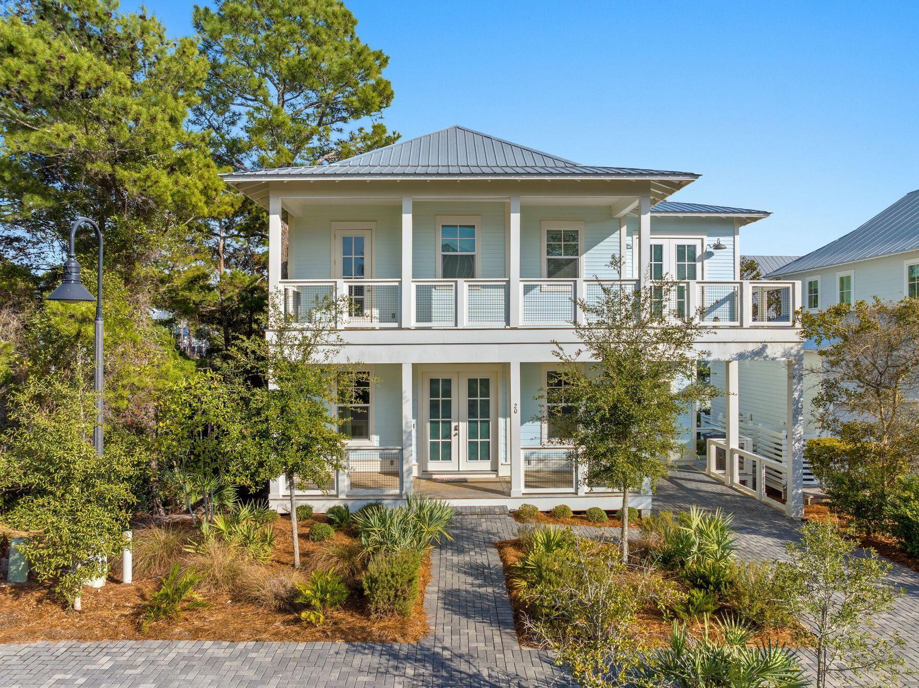Beautifully appointed and perfectly located in the sought-after community of Lakeside at Blue Mountain Beach, this two-story beach cottage exudes comfortable, coastal luxury. It sells fully furnished and turn-key ready, ideal as a rental investment or second home. Situated a short walk to the community pool and less than a half mile from easy beach access with parking, this 4 bedroom, 3.5 bath home is the ultimate vacation escape featuring over 1,200SF of covered porches and balconies, an attached garage, and an inviting open floor plan. Interior features include LVP flooring, quartz countertops, and more. Enjoy the afternoon shopping and dining in Blue Mountain Beach, paddleboarding on Big Redfish Lake, or exploring neighboring communities along Scenic 30A via the bike trail.