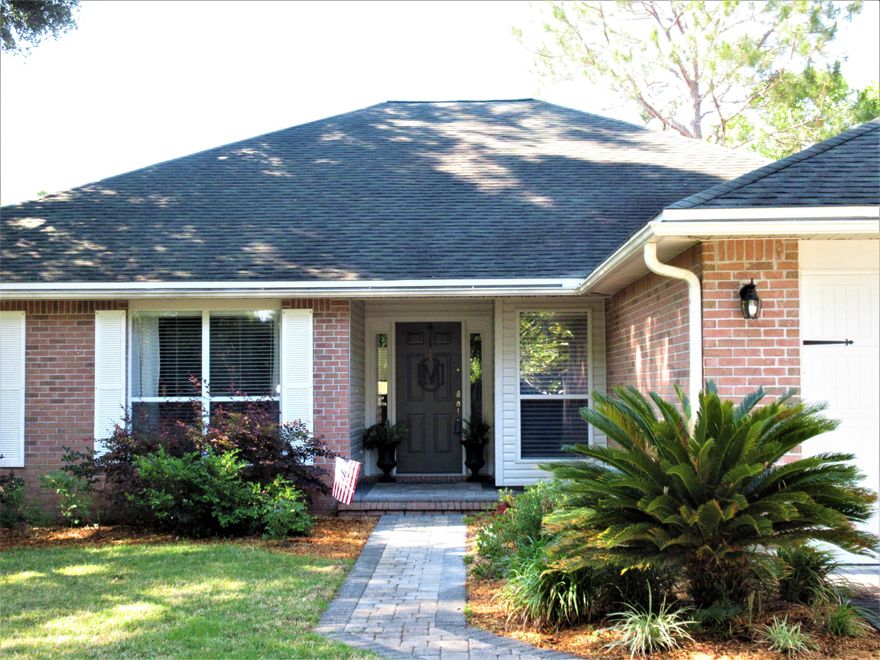 Price Reduced. Aluminum Fence to be installed next week. Located in the highly sought after community of Hidden Lakes, this split bedroom home features spacious rooms with 10 ft ceilings and a resurfaced fireplace overlooking one of Bluewater Bay's many lakes. The living room is ideal for family time and entertaining alike, with orange peel ceilings and crown moulding, this room is open to the breakfast nook and recently remodeled kitchen. The warm and welcoming gathering spaces lead to the large covered lanai, perfect for relaxing and entertaining lakeside. The beautifully remodeled kitchen includes stainless steel appliances and a white subway tile backsplash, making this home the envy of the neighborhood.