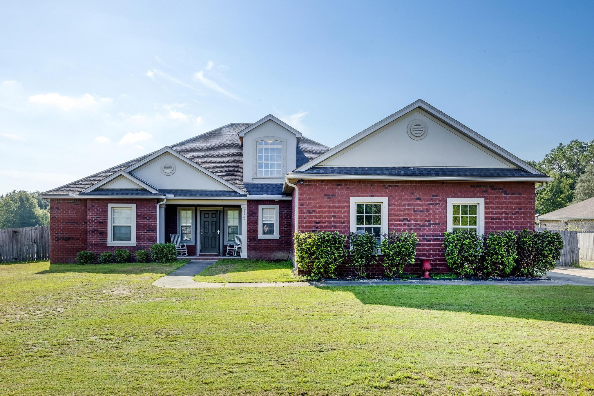 Welcome Home to 4585 Durbin Ln! This home offers lots of space both inside and outside. Sitting on 1 acre, the home itself is over 3,000 sq. ft. From the moment you walk in the front door, you are greeted by a tiled bench seat/mudroom area. With just a few more steps, you are in the Living room, which features built-in bookcases, tall ceilings, and crown molding. The open flow of the living spaces from the living room, flex room, into the dining area, and then into the spacious kitchen is captivating. Downstairs features a split floorplan with pocket doors to either ''wing'' of the home. The Primary bedroom has a spa-like en-suite bathroom with separate vanities, a water closet, a garden tub, seperate shower, and two LARGE walk-in closets. Across from the primary bedroom is another spacious bedroom with a massive walk-in closet. In the other "wing" are two bedrooms separated by a shared Jack n' Jill style bathroom. Upstairs, the expansive private bedroom features yet another full bath. The indoor laundry room has built-in cabinetry and shelving. And wait.... there's more! Just off the garage is a fully tiled DOG ROOM plumbed for bathing your furry friends! Cool off out back in the above-ground pool with a massive deck, or plug in your camper to the 50amp service! This home really does have it all. Schedule your showing today!