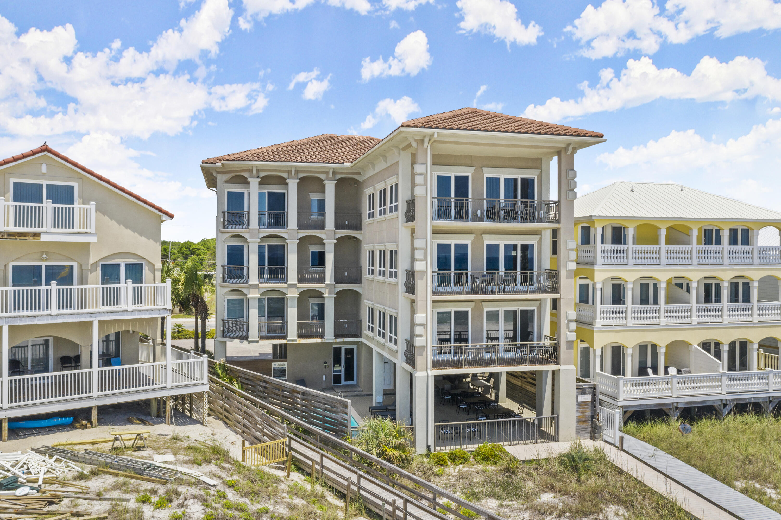 GREAT RENTAL INVESTMENT PROPERTY with 3 separate CONDOS in the building one condo each on floors 2-4. Each condo has 4 bedrooms, 4.5 baths per unit with approximately 2500 SF living space and two private balconies. Gourmet kitchen with custom wood cabinets, granite, stainless appliances wet bar with wine storage. Upgraded finishes throughout with magnificent gulf water views from most rooms. Whirlpool tubs in master baths overlooking the gulf. Beautiful tile floors wtih decorative rugs and comes lavishly furnished. Ground floor area has elevator, pool, bath, shower, beach access, storage, and amble parking. Highest quality concrete construction with metal studs, tile roof, and stucco exterior. NO HOA FEES and GROSS RENTAL PROJECTIONS OF $444KSELLER WILL CONSIDER OWNER FINANCI