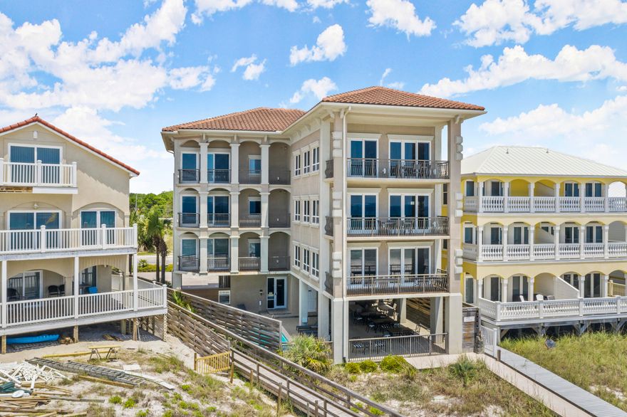 GREAT RENTAL INVESTMENT PROPERTY with 3 separate CONDOS in the building one condo each on floors 2-4.  Each condo has 4 bedrooms, 4.5 baths per unit with approximately 2500 SF living space and two private balconies.  Gourmet kitchen with custom wood cabinets, granite, stainless appliances wet bar with wine storage.  Upgraded finishes throughout with magnificent gulf water views from most rooms.  Whirlpool tubs in master baths overlooking the gulf.  Beautiful tile floors wtih decorative rugs and comes lavishly furnished.  Ground floor area has elevator, pool, bath, shower, beach access, storage, and amble parking. Highest quality concrete construction with metal studs, tile roof, and stucco exterior.  NO HOA FEES and GROSS RENTAL PROJECTIONS OF $444KSELLER WILL CONSIDER OWNER FINANCI