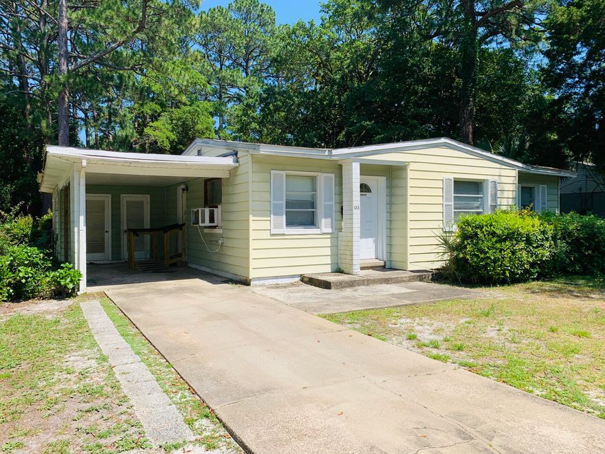 Cute Florida Cottage with tons of potential in a great location close Downtown Fort Walton Beach and minutes to the beaches. This one owner home is in good condition. Featuring 3 bedrooms, 1 bath and a good size kitchen with wood cabinetry. The living room has great space with tons of sunlight from 2 large windows. Bathroom has entry from the hallway and the large living room addition on the back of the home. Use this bonus space for a 4th bedroom, additional living room or entertaining room. The laundry room is located just behind the 1 car carport. The owners had the back patio enclosed and is not included in the listed heated sqft. The roof will need attention. Home has 2 AC window units as well as a floor gas furnice in the hallway. No central AC. C all for more information