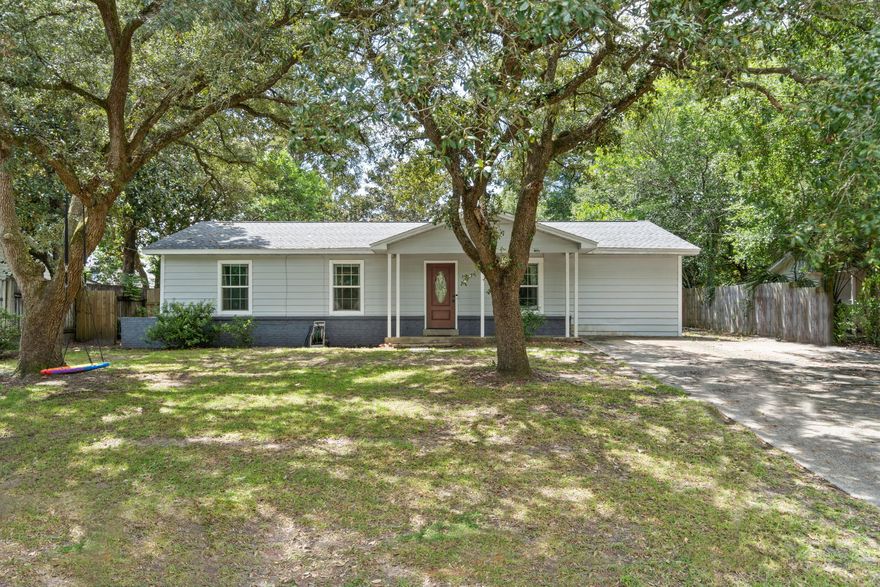 Welcome home to this perfectly located 4 bedroom, 2 bath Fort Walton Beach home that has been completed and beautifully renovated from top to bottom! It was built in 1960 but as an effective date of 2000 thanks to all the updates! Have peace of mind with updated copper wiring and a roof, water, heater, and HVAC system that were all replaced in 2018. Located on a 0.21 acre lot you have a great sized backyard complete with backyard storage building. Inside your jaw will drop at the stunning updates and you'll love the hard surface flooring all throughout the home - no carpet at all! The living room opens to the dining space where you'll find a beautiful kitchen featuring white shaker style cabinets, stainless appliances, granite counters, lovely natural wood open shelving, a pantry, and recessed lighting. Through the barn door you'll find a spacious fourth bedroom and a large 8x8 interior laundry room with extra storage space! The other three bedrooms are located on the other side of the house. The master bedroom is a perfect size for your king sized bedroom suite, and it features two separate closets and an en suite bathroom beautifully appointed with a tiled surround tub and custom vanity with modern lighting and tile flooring. The other two bedrooms are also located down the hallway with a shared bath also with a beautiful custom vanity, tile flooring, and a new tub. The washer and dryer will convey as is and there is a survey available! Don't delay on this gem of a home!