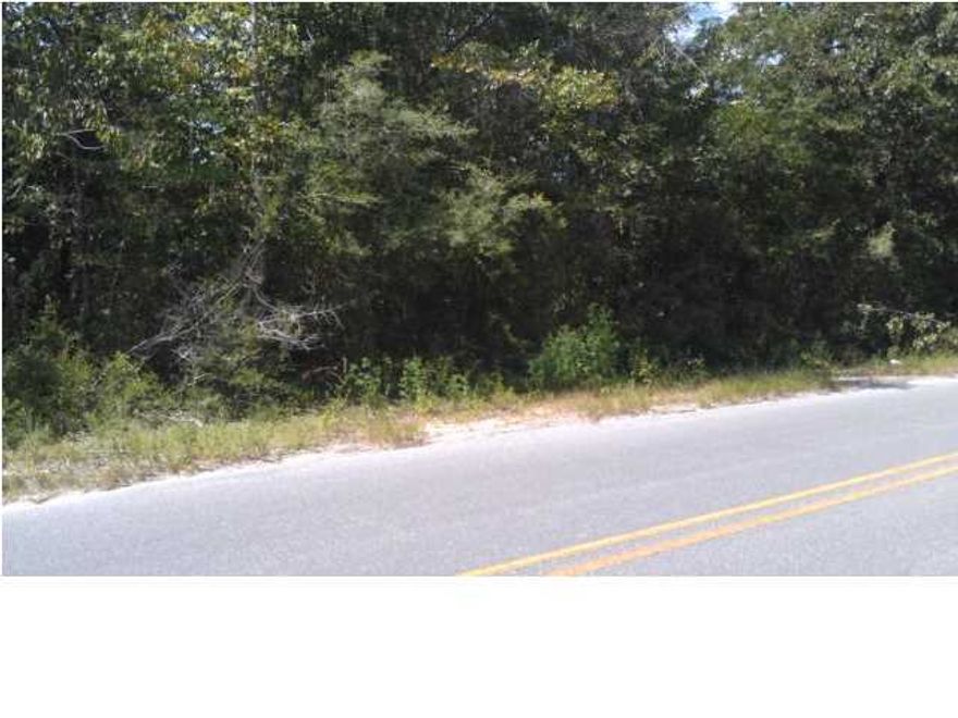Nice level lightly wooded lot with paved road frontage close to town. Large almost one acre lot. City water and power are available out front. Priced to sell.