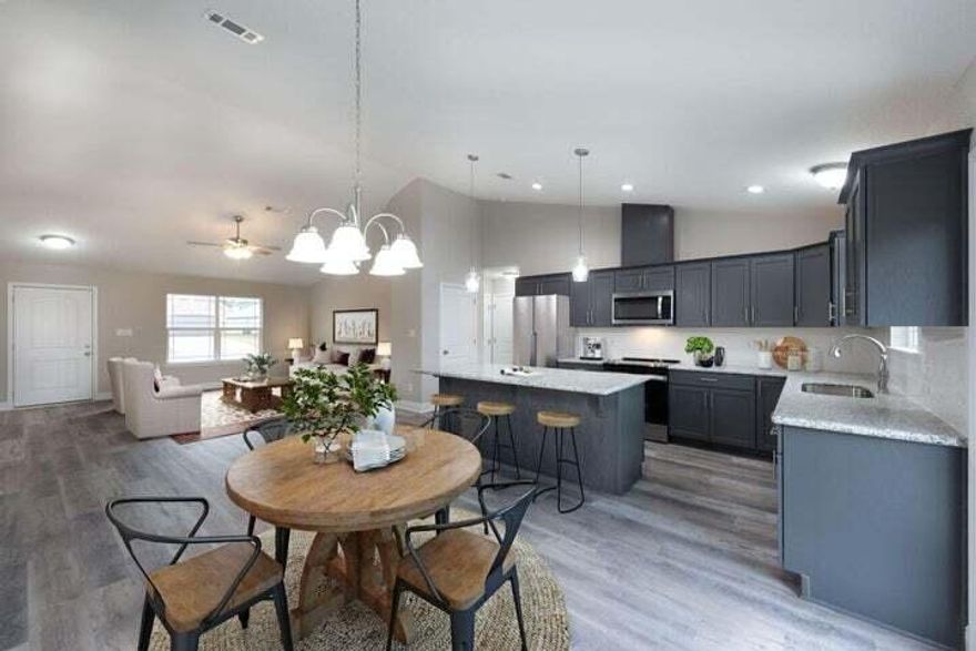 **NEW CONSTRUCTION,** No detail missed in this Endearing New Construction Bungalow, that will be sure to make youprideful in home ownership. This home was built by the highly reputable Country Manor Homes Inc. that includes lowmaintenance and energy efficient finishes that will make upkeep a breeze. You will experience the custom craftsmanshippresented in every corner of this adorable abode. Curbside, you will notice the sodded yard to the loveable shutters completewith all brick and hardy plank exterior for ease of insulation and stability. Upon the idyllic front porch, you can enjoy watchingthe sunsets or rocking the stress away in your easy-chair. When entering, you will notice the thoughtful approach ofaesthetics from the coordinating paint color, luxury vinyl plank flooring everywhere