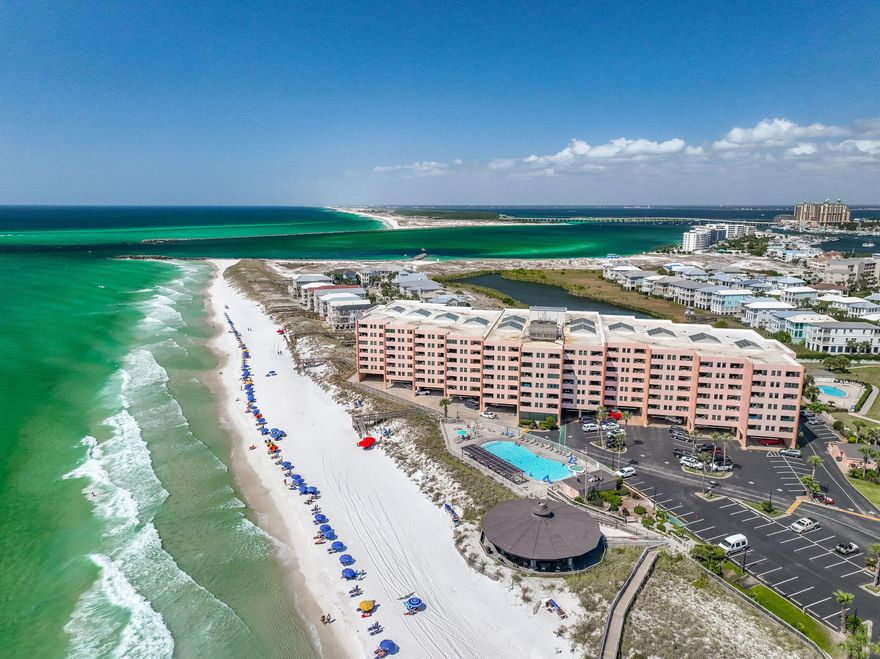 Enjoy western sunsets over the East Pass, the Jetties, and Crab Island with this 1 Bed/1Bath condo located on the 6th level. Views from balcony of this condo include the Destin, seasonal Firework shows, fishing fleets, and dolphins playing!  Enter this condo from the covered breezeway into the large foyer! The condo features a large primary bedroom with king size bed, a full bath, a kitchen, and living room! The Kitchen features granite counter tops with a backsplash, a center island, stainless appliances, shaker cabinetry, and brushed nickel hardware. The appliance include a slide in electric stove and oven, built in microwave, dishwasher, and refrigerator. The granite countertops extend to include a desk area for an office space. The living room has been updated with modern finishes, a flat screen TV, and an updated EFCO (Category4) sliding glass door. The unit has updated luxury vinyl plank flooring and newer lighting. 

New Hot Water Heater Sept 2024   Gross Rental Income 2023 $41,289 and 2024 $35,788.  Sunsets, fishing boat traffic, fireworks, and unobstructive views of East Pass makes this condo special! Jetty East Amenities: 900 feet of deeded beach, 2400 sq. ft. pool with sun deck, hot tub, beach side pavilion with charcoal grills, tennis courts, pickleball, fitness center kid's activities, music entertainment, shuffleboard, covered parking, 24/7 security & meeting room, 6-story building with under building parking. Holiday isle offers Louisiana Lagniappe restaurant, close to grocery store and shopping! Buyer to verify all dimensions and information. 