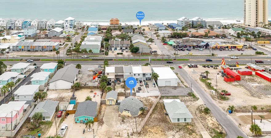 PRICE REDUCTION.  Welcome to your coastal retreat! This unique dome-shaped home, just 2 minutes' walk from the pristine white sands of the Gulf of Mexico, offers the perfect blend of modern comfort and beachside charm. With 2 full bedrooms and an additional loft bedroom, this home provides plenty of space for family and guests. The beautifully updated kitchen is perfect for preparing meals, while the spacious bathroom offers a refreshing escape after a day at the beach. The studio has been thoughtfully transformed into a separate living space with a sleeper sofa, kitchenette, and its own bathroom--ideal for guests or as a private getaway. Enjoy the serene outdoor patio, complete with a grill area and fire pit, perfect for relaxing evenings under the stars. This home is currently being used as a short-term rental, making it an excellent investment opportunity. Enjoy easy access to public boat ramps just half a mile away, and take advantage of the convenience of nearby entertainment, restaurants, and shops all within walking distance.