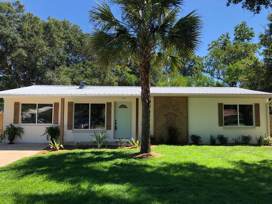 REMODELED TO PERFECTION!Adorable completely remodeled Florida Cottage located on a huge .25 acreage lot near great schools in the heart of Fort Walton Beach.This home features NEW EVERYTHING! Brand New AC. All new electrical and plumbing throughout. Brand new waterproof luxury vinyl throughout entire house, granite countertops, new cabinets in kitchen and both bathrooms, new stainless steel appliances, gorgeous walk in shower in master, bright and open sunroom, split bedroom plan. Home is a solid center block with metal roof, cedar shutters and columns, large backyard with utility shed, beautifully landscaped... plus so much more! This is a must see property!! Not anything on the market like it. Will not last long!
