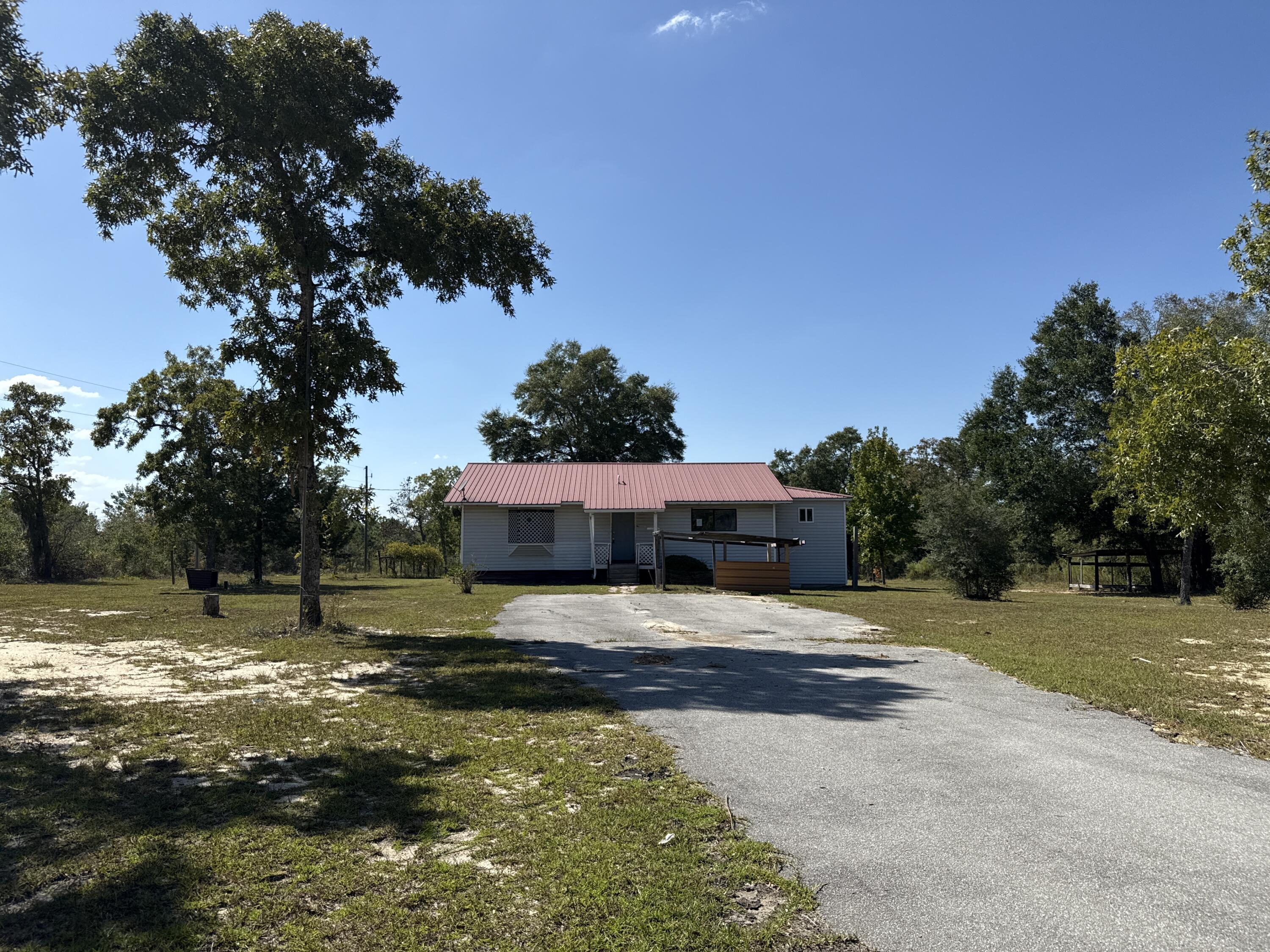 Charming 2-bedroom, 2-bathroom single-family home offering 1,512 Sq Ft. of living space on a spacious lot in Alford, Florida. Located near the scenic McCormick Lake, this property is part of Compass Lake in the Hills, a deed-restricted subdivision with a voluntary HOA. For a small annual fee, residents can enjoy access to two spring-fed lakes with opportunities for boating, fishing, and other water activities. Additionally, the home features a 280 Sq Ft unfinished basement. Conveniently situated only 14 miles from I-10 and 47 miles from Northwest Florida Beaches International Airport, this home combines privacy, recreation, and accessibility in a sought-after rural setting. Don't miss out on this great opportunity with lots of potential. Schedule your showing today.