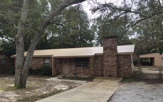 Great Location!!! All Brick home. Owner added a full 2nd bathroom along with a rear bonus room. This Home sits on .43 of an acre. Close to all amenities. Living area and family area with wood burning fireplace. Ceramic tile in Kitchen and Dining area, Solid wood in Den and Parquet flooring in family room down hallway and in Master Bedroom. 2 other bedrooms have carpet. A new Metal roof installed May 2014. Trane installed 1997 and serviced every year. Location within walking distance to schools and shopping. The 43'x25' workshop is in excellent condition and each side is covered for boats, Rv. You name it. Great Starter Home, Great Investment.