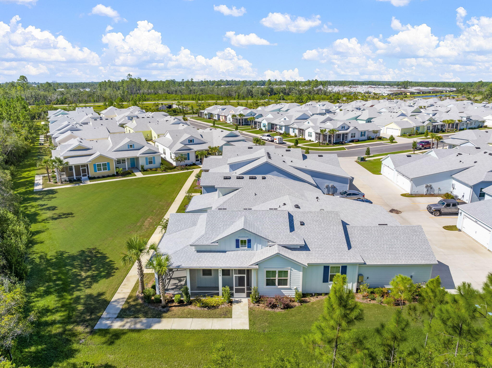 **Charming Dreamsicle Cottage with Private Preserve Views in Latitude Margaritaville Watersound** Welcome to your serene oasis in the heart of the 55+ community of Latitude Margaritaville Watersound! This stunning Dreamsicle Cottage is more than just a home; it's a lifestyle defined by comfort, convenience, and captivating natural surroundings. Nestled on one of the most private lots in the community, this dwelling offers an unparalleled connection to nature, with views that overlook the tranquil preserve, providing a peaceful retreat right at your doorstep. **Exterior and Lanai:** As you approach, you'll be greeted by a meticulously landscaped yard leading to an inviting screened and epoxy lanai--perfect for enjoying morning coffee or evening gatherings while soaking in the beauty of your surroundings. With added features like an extra GFCI outlet, an outside ceiling fan, and recessed lighting, the outdoor space seamlessly extends your living area. Safety and security are paramount, highlighted by the ADT system with three cameras and a doorbell, ensuring peace of mind. **Whole House & Garage:** Step inside this beautifully designed home adorned with 8' doors and luxurious faux wood blinds. The elegant 5-??'' baseboards and crown molding throughout the house create a refined atmosphere, while the wood-look tile flooring offers both style and durability. The chef's kitchen boasts quartz countertops and top-of-the-line Whirlpool appliances, complemented by a full-height backsplash and gas drop at the range. The spacious garage features an epoxy floor, overhead storage racks, and a utility sink, ensuring you have ample space for all your storage and organizational needs. **Kitchen:** Cooking and entertaining are a delight in this well-appointed kitchen, equipped with a Whirlpool refrigerator, gas range, microwave, and dishwasher. The island, adorned with two pendant lights, serves as a perfect gathering point for family and friends, making every meal a cherished occasion. **Den:** An inviting den awaits with a solar tube skylight that floods the space with natural light. The custom ceiling fan and recessed lighting create a warm and welcoming ambiance, ideal for relaxation or hobbies. **Great Room:** The great room seamlessly connects with the kitchen, designed for entertainment and relaxation. With recessed lighting and safety features like smoke and carbon monoxide detectors, you can enjoy your time here with confidence and comfort. **Primary Bedroom En-Suite:** Retreat to your spacious primary bedroom, featuring a pocket door leading to the en-suite bathroom, ensuring privacy and convenience. The custom ceiling fan and recessed lighting enhance the tranquil atmosphere, while the elegant shower, complete with wall tile to the ceiling, offers a spa-like experience. Thoughtful details like reading lights and custom wall hooks add to the convenience and charm. **Bedroom 2:** The second bedroom offers comfort and versatility, equipped with recessed lighting and a custom ceiling fan, perfect for guests, a home office, or a cozy reading nook. **Bathroom 2:** The second bathroom features a seamless shower conversion and custom wall cabinets, providing practicality without compromising on style. The tile flooring and wall hooks add a touch of elegance while ensuring functionality. **Laundry:** Enjoy the convenience of an in-house laundry with washer and dryer included, making everyday chores a breeze. **Location:** Situated just a 5-minute golf cart ride from the vibrant town center and public retail, this home offers both the peace of a private preserve and the accessibility to community amenities. Living in Latitude Margaritaville Watersound means embracing a lifestyle filled with fun, friendship, and leisure. Don't miss out on this rare opportunity to own a piece of paradise in one of the most sought-after communities. Schedule your showing today and experience the magic of the Dreamsicle Cottage