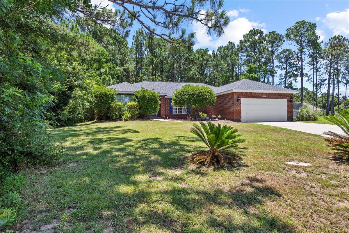 Nestled at end of street with lots of peace and quiet. Fantastic split floor plan. Well maintained. Roof replaced in 2021. 4 bedroom 2 bath home is awesome purchase for a large or growing family. Fenced in back yard with loads of privacy. Wood looking tile floor. Spacious great room featuring gorgeous hardwood flooring, plant ledges & an elegant, tiled wood-burning fireplace...also open to your formal dining room complete with hardwood flooring, as well. Exquisite, tiled gourmet kitchen open to the great room (perfect for entertaining) This property is a jewel you don't want to miss!