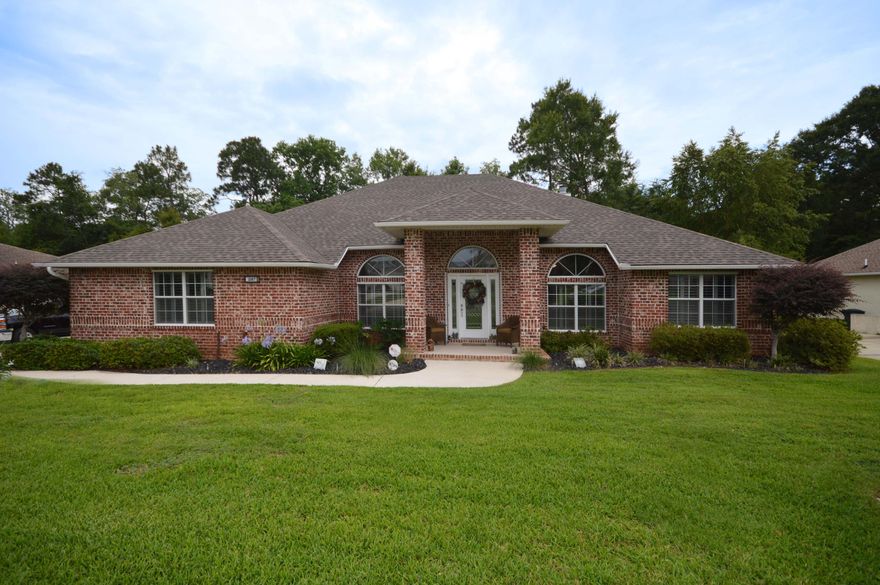 This Home is a MUST see!! All Brick exterior and a Contemporary Open Floor plan. Meticulously maintained, with many quality upgrades. Separate office and Formal Dining room. Kitchen opens to breakfast area and Great Room. Great room looks out onto Custom Florida Room with a view of the back yard that's nestled in the serene privacy of a manicured green belt. This home offers a popular split floor plan with a second private Master suite that leads to the cozy Florida room. Other extras offered, include: NEW Roof (2017), Detached Garage built in 2016 with an automatic garage door opener. High Impact hurricane windows and door; an insulated ceiling in the Florida Room, Plantation Shutters, Hurricane Shutters, and wired for Surround Sound. A Built-in Vacuum, and Whole house Generator.