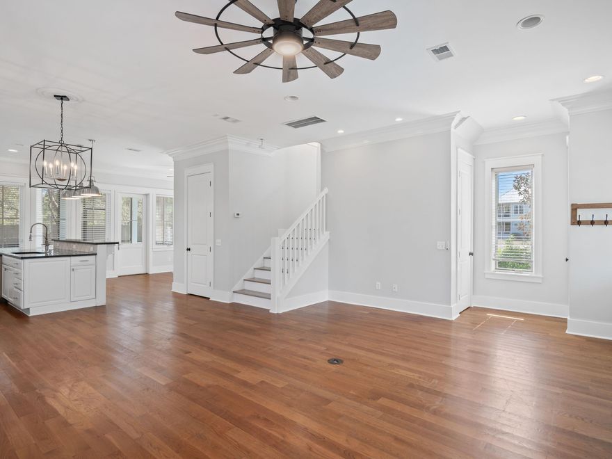 New $49,000 Price reduction! Seller says bring him an offer! Enjoy a quiet location in Cypress Dunes, this spacious two-story home overlooks a natural pond and established trees. Three large porches, one screened, provide plenty of outdoor living space in addition to an enviable fenced backyard for pets and children to play. This home has recently been updated with new exterior paint, fans and light fixtures. New appliances include a washer and dryer; both HVAC units were replaced in 2020.  Large picture windows flood the open living space with natural light while framing serene views of the cypress pond across the street. The pristine white kitchen has black granite countertops that extend onto the island and a high-top breakfast counter for casual