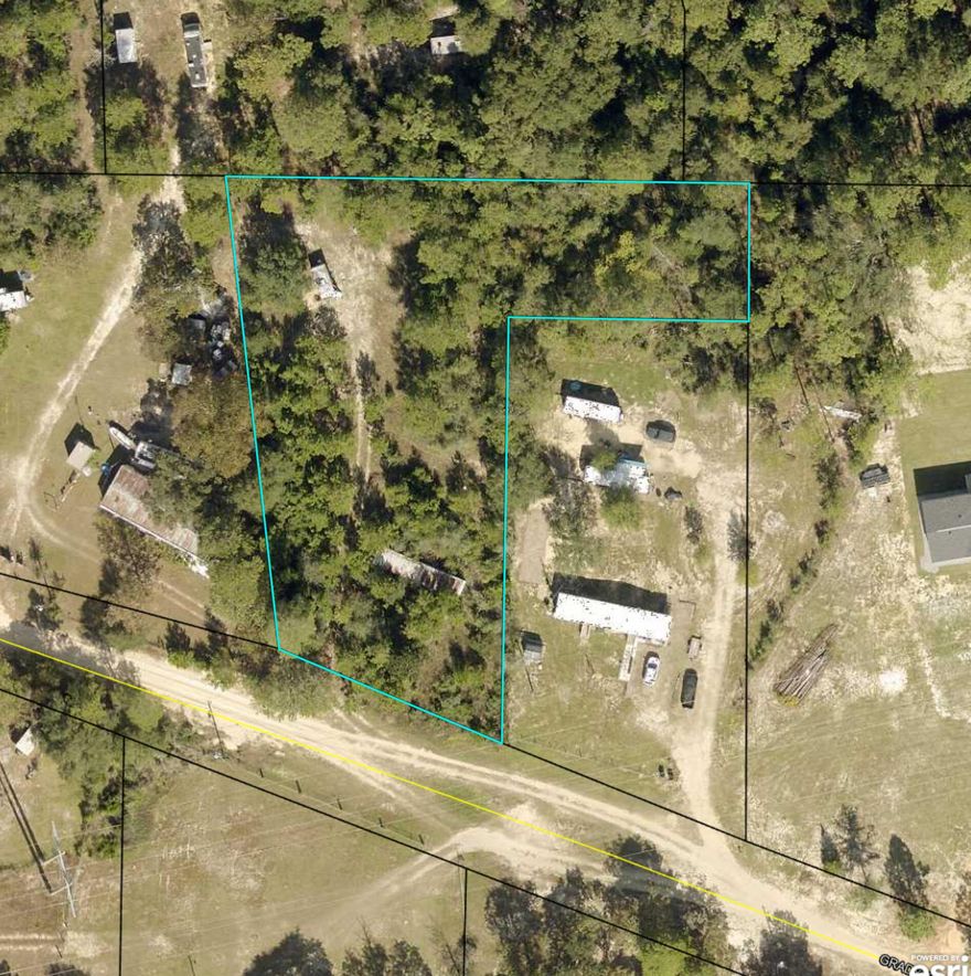 Unlock the possibilities with this nearly one-acre gem! Situated on a private road, this .97+/-acre lot is primed for development. With a private well, septic, and public water access already established, you'll save valuable time and resources. The existing mobile home sites offer a foundation for your vision. Conveniently located just 5 miles from Crestview and with direct access to E Highway 90, this property is an ideal investment for those looking to build their dream home or explore development opportunities. Invest on the areas growth, with new developments popping up close by.