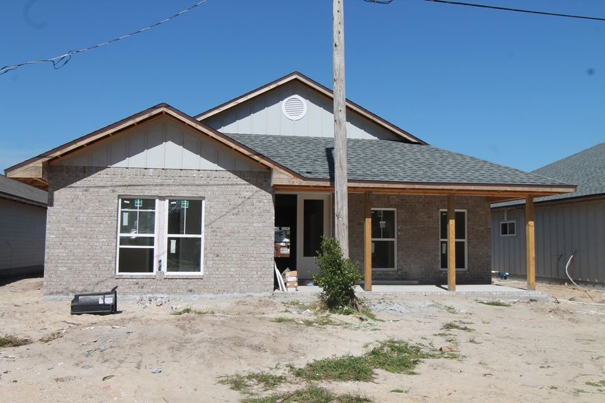 Introducing ''Temple Park at Port Dixie'', a 40 lot development is Shalimar with both underground utilities and broad sidewalks. 9th. Avenue offers wide streets, off street parking for visitors and guests, and homes with rear entry garages. This 4BR/3BA, 2CG custom brick homesite has 10 Ft. ceilings w/ impressive crown molding, LVP flooring throughout most of the home, tile in the master bath, and 5 1/4'' baseboard throughout. Kitchen boasts custom painted Gray cabinetry, granite countertops, a large pantry, and stainless appliances (including an oversized commercial grade refrigerator/ freezer). Master suite is in the left rear of the home, is very roomy, has 2 large walk - in closets, a marble walk - in shower with glass enclosure, a whirlpool garden tub,