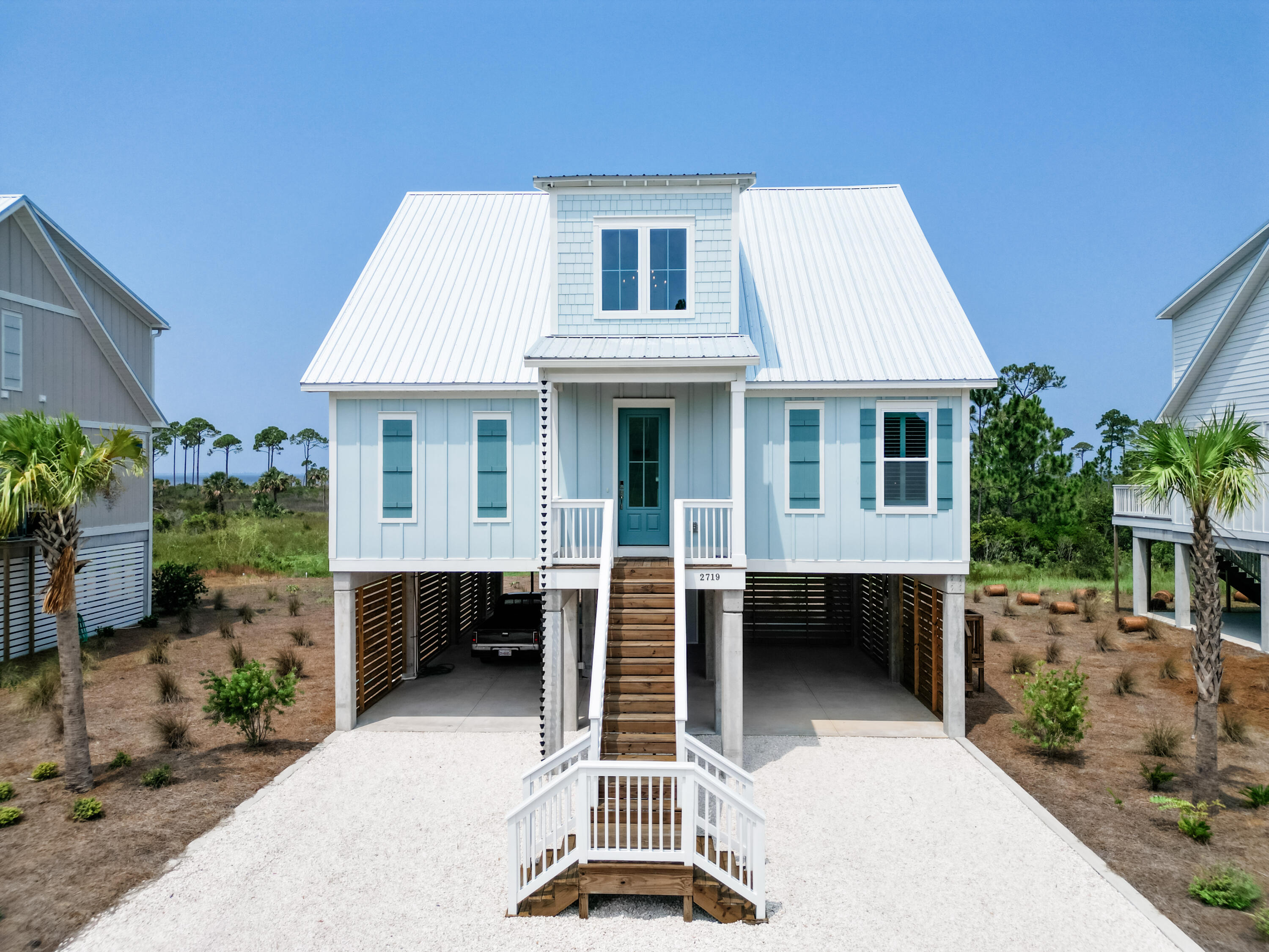 Enjoy year round beautiful westerly facing sunsets over St Joseph's Bay. This Luxury listing located in the coastal community of Simmons Bayou, is equidistant between Port St Joe and Cape San Blas. Incredible, unobstructed views from your rear porch overlooking beautiful St. Joseph's Bay! The two-level Ocean Floor Plan built by Truland Homes offers ample indoor and outdoor living space. Enjoy your main level screened-in back porch, that is perfect for entertaining or head up to your second level balcony to enjoy an elevated view of the most beautiful Gulf Coast Sunsets! Enjoy high-end features through the entire home, including a separate tub and shower in the primary bathroom. The main living area offers 10 ft. ceilings and 9 ft. ceilings on the second level. The second level features two identical bedrooms, with ensuite bathrooms and a bonus space that is perfect for a kids play area, tv room or office space! All doors and windows are high impact- great for insurance credits! The finished carport allows for ample parking and storage for beach toys! Additional locked storage space located in the center of the covered parking area! Just a short walk from your home, enjoy DEEDED BAY ACCESS that is currently under construction! When you are not enjoying the views from your home, you can access the Public Gulf Access Point just minutes from your home or Downtown Port St. Joe, less than a 5-minute drive away! This home allows for short term rentals or your perfect forever home in Port St. Joe! Possible assumable VA Loan available*. Some dimensions were obtained from the Gulf County Property Appraiser's Office. Please verify if important.