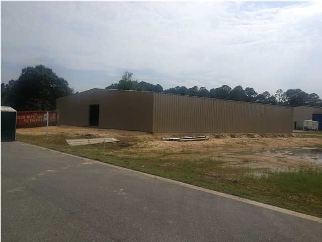 This listing does not include the building (Lot 2.) The listing is Lot 3 only.