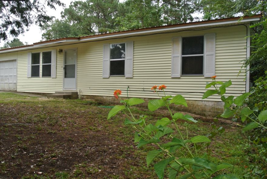 MOTIVATED SELLER - Bring An Offer! Updated and affordable home located in a quiet cul-de-sac & convenient to city amenities. This home has a spacious living & eating area with 3 bedrooms and 2 bathrooms. Brand new tile flooring in living areas and bathrooms & laminate in the bedrooms! The property features a one car attached garage with an added window a/c unit and a large backyard with mature trees. Closed cell spray-foam R-value 14 insulation was just put under the entire house! See this home today! Buyer to verify all information deemed important.