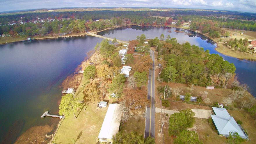 Newly renovated mobile home in beautiful Paradise Island S/D. Home is surrounded by Kings Lake, which is an excellent fishing lake. Quiet and peaceful with a lovely view of the lake from this waterfront lot. Home has private fishing dock and two storage sheds. The screened back porch makes a great place to relax and enjoy the scenery. Home has been renovated in 2013, including kitchen and bathrooms, as well as new central unit. Home is in move in ready condition. Convenient to Defuniak Springs. Bring your fishing pole and enjoy the island life!