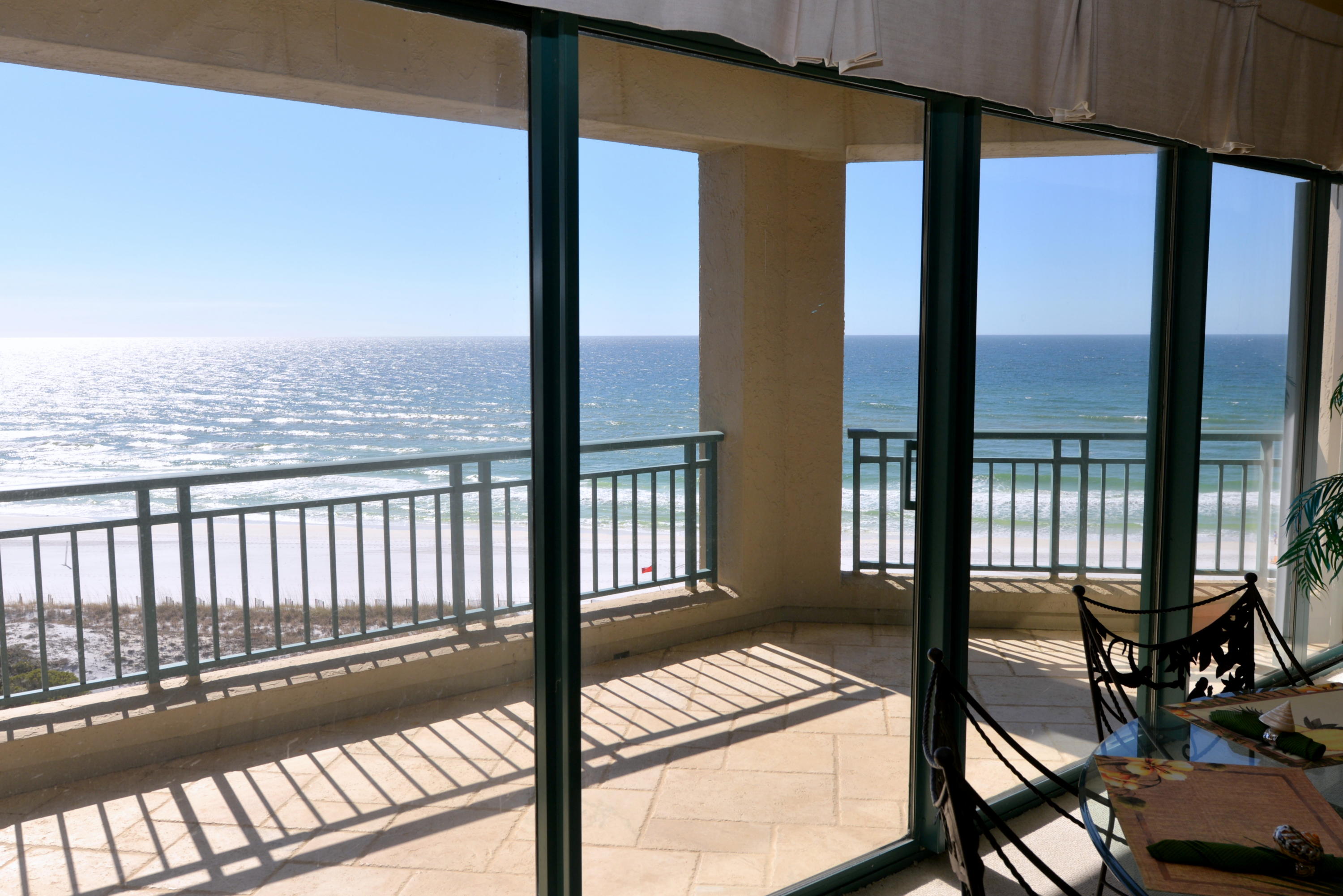 LIGHT FLOODS THE ROOM as you enter the doors of this classic 8th floor three bedroom, three bath end unit. Unsurpassed views of sunsets & the beautiful emerald waters washing over the white grains of sand are enjoyed from the wall of windows in the living room and from the spacious balcony. This luxury condo is in excellent condition & is well-furnished. There are two living areas separated by a spacious dining area all overlooking the gulf. Each bedroom has its own private bath with the master suite featuring a luxury bath, a walk-in closet, & direct access to the balcony. Other amenities of this corner unit include an open floor plan, a spacious laundry room, a storage unit, new tile in the foyer & hall, stone tile on the balcony, & covered parking. Southwinds II is a non-rental