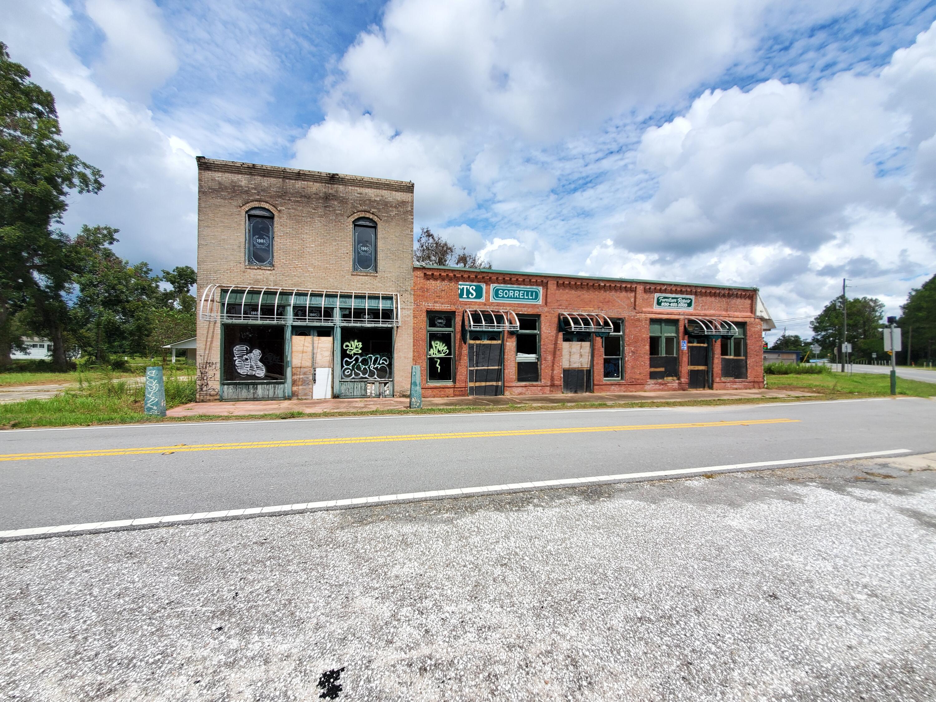 Iconic building in the center of downtown Laurel Hill. Building is divided into 3 different units that can be leased individually at $7.50/sf or all together for $6.00/sf. Units are 1680sf, 2952sf, and 1950sf totaling 6582sf.