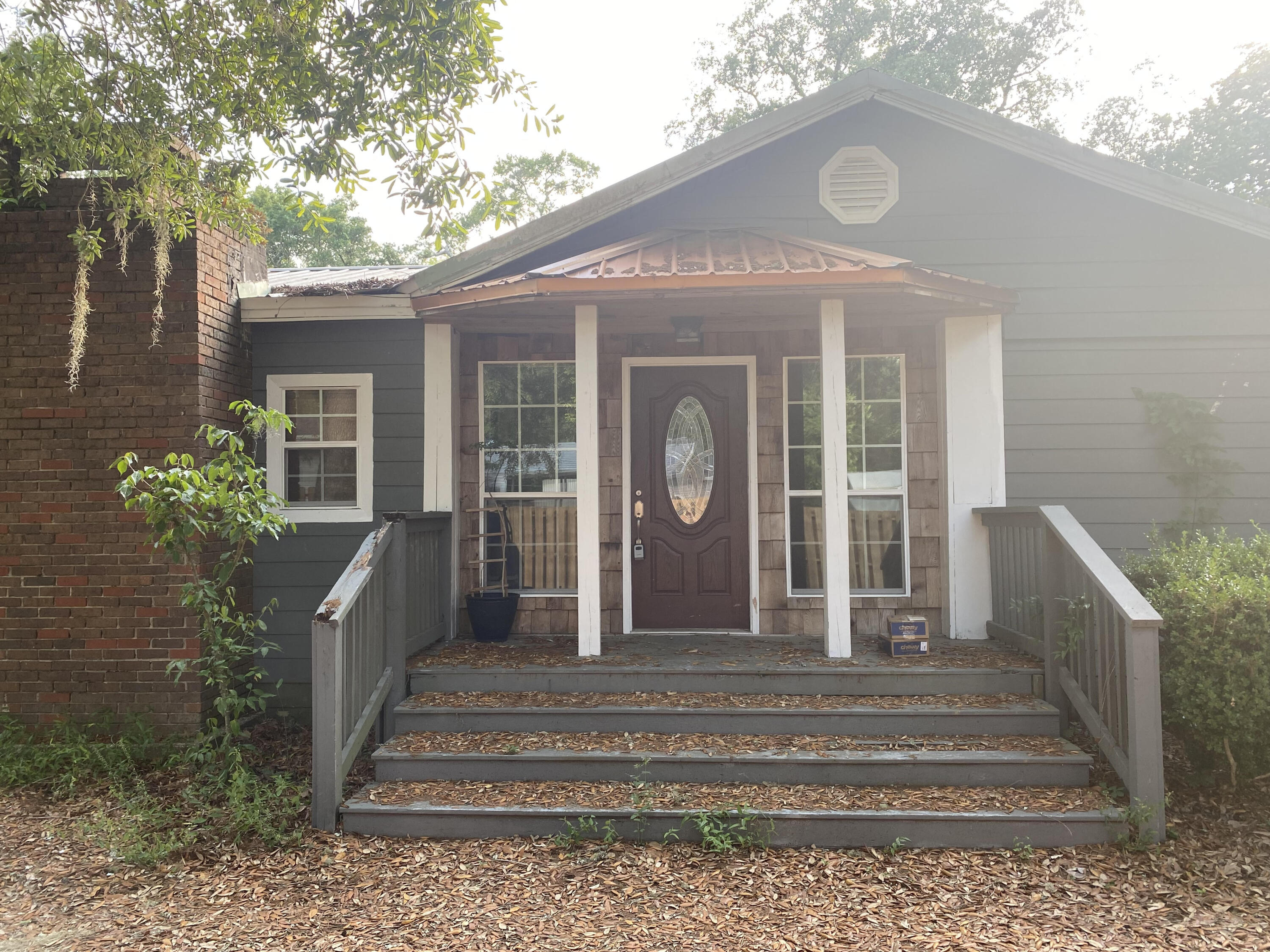 BACK ON MARKET NO FAULT OF SELLER! ACCEPTING BACKUP OFFERS! CASH or CONVENTIONAL only! Fixer Upper nestled in a great location in Choctaw Beach 2 blocks from the Bay! Beautiful Oaks give this home charm. 2 Car detached garage was converted into a Mother-In-Law suite-kitchen, bath, living room and 2 bedrooms. However, it is converted back to a garage. Plenty of space in this home. Large Master bedroom with hardwood floors. Master bath is both spacious with his-n-her sinks, deep tub and separate shower. 2 spacious closets as well. 2 medium sized bedrooms share a hall bath. Large room added on has a closet so can be classified as a 4th bedroom. Fireplace separates the large kitchen from the living room and sitting room. The kitchen has plenty of cabinet space, glass top stove/range, stainless steel range hood, stainless refrigerator, dishwasher, farm style sink. 2 windows accent natural light. Home has a Metal roof, newer AC system however there are Foundation issues (Crawl space).
Do not know to what extent. Both sides of home have large wooden decks, one is covered. There are existing small man-made pond areas with a crossover bridge, similar to a Japanese garden area. The covered deck covers the width of the North side of the house. South side deck is 2 layered and in good shape. There is a yard building partly built of cement blocks however, the wood area has wood rot. Very private with high privacy fence all around the home. Plenty of driveway space with this one! RV Parking, Boat and multiple cars.
Don't wait this diamond in the rough won't last long.