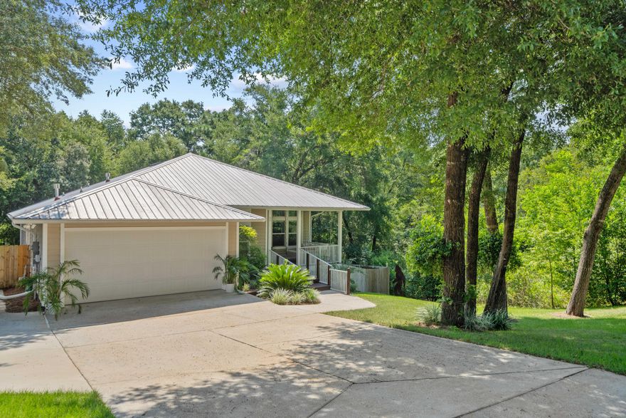 Custom home nestled away on the edge of Valparaiso ready to meet it's new family. It will be hard to find a home that offers this much storage and convenience. Minutes away from the Eglin Air Force Base main gate, VPS airport, and an easy ride into the restaurants and shopping of Niceville. The spacious layout starts when you drive up the extended driveway and walk to the large front porch. The hanging daybed was added for watching the neighbors in comfort and style. Stepping in the front door you will be greeted by an open floorplan and tall ceilings with crips walls and large windows filling the space with natural light. The kitchen features a custom breakfast bar which matches the coffee nook and pantry. Tall white cabinets have it feeling airy and storage friendly. In addition to the living area, the upstairs features the primary bedroom, laundry room, 2 car garage, and a private half bathroom. The days of hauling things up and down the stairs daily are over! Don't forget the screened in porch which makes the perfect extended living room. There is a gas line on the patio for the grill enthusiasts.
Downstairs is where the storage really gets good. Two large bedrooms and a full bathroom make for a family functional layout with a flex room perfect for a play area or office. The bathroom includes a large under-the-stairs closet and linen perfect for tucking things away. There is also a large, covered cobblestone patio perfect for a game/play area. At the end of the patio is the giant 28 x 10 storage room so you can actually use the garage for cars or that jet ski you've really been wanting. Around the corner under the front porch is even more storage for the lawn equipment or paddleboards. No more wondering where things will fit, this home is ready to store it all! 
We're almost done, but there's just so many amazing things to add. There is a current survey available for the home and with newer construction comes lower insurance premiums. Saving money, adding endless storage, it's a no brainer move! Schedule your personal tour today to see it all for yourself.