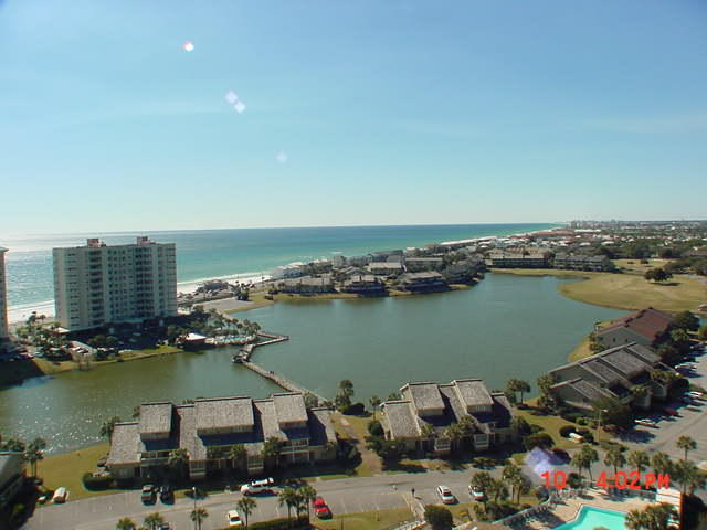Great Views from the beautifully furnished 2 bedroom/2bath unit in Ariel Dunes II! This unit with 9 foot ceilings features a beautiful kitchen with granite countertops, wood cabinets, and GE appliances. Sellers have updated the flooring to engineered wood floors in living and bedrooms. Ariel Dunes II units also have an outside storage unit. Enjoy the two large pools totaling approximately 12,000 square feet as well as convenient deeded access to over 2,000 feet of white sugar sand beach which is less than 200 yards away. Ariel Dunes II is located in Seascape - a gated community offering amenities such as golf, tennis, pools, and a conference center. All measurements are approximate and should be verified by buy