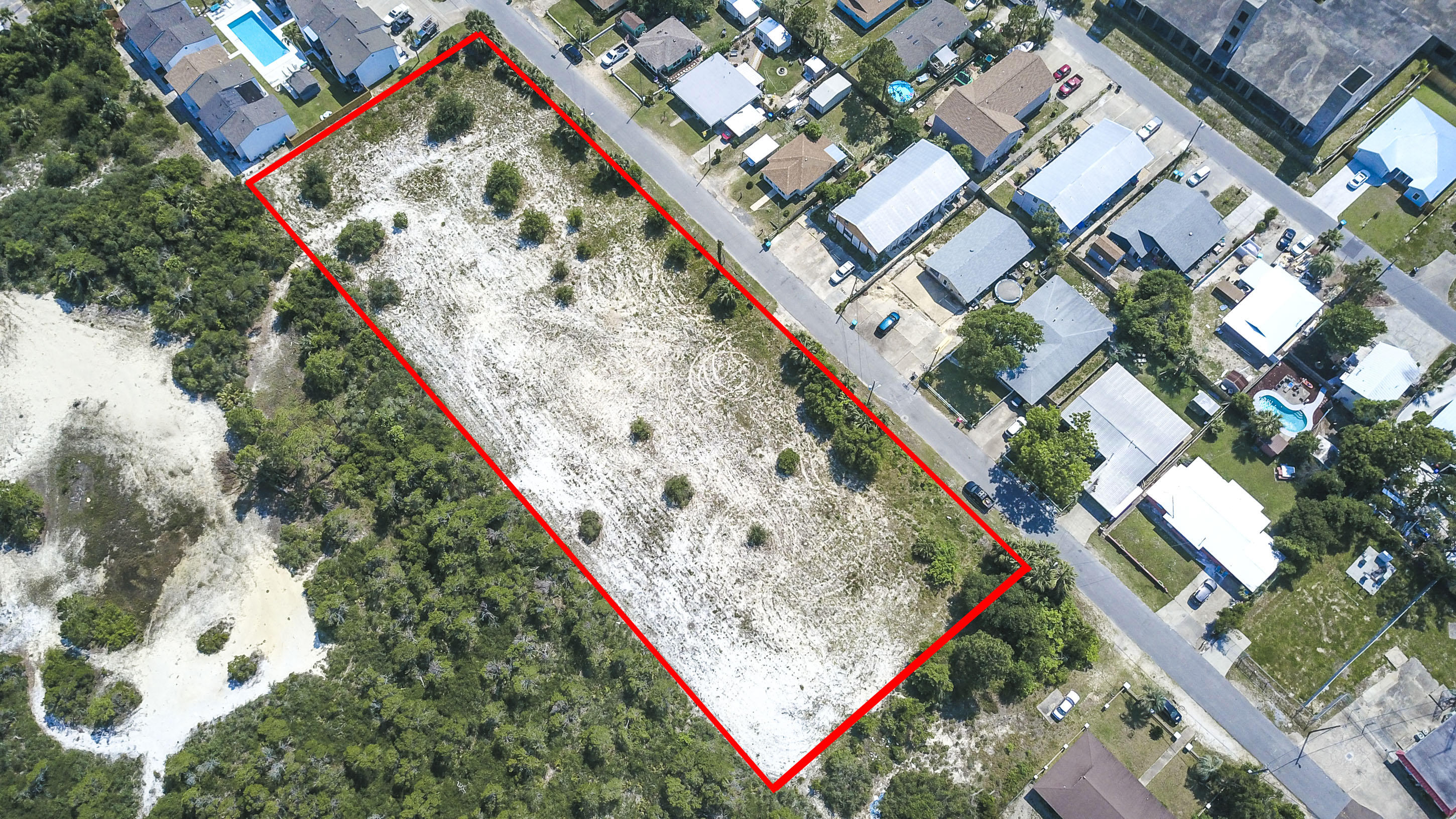 1.95 Acre Development site centrally located on Panama City Beach - Commercial High Density/Tourist District land use classification. Perfect site for hotel, apartments, condos or mini-storage.Parcel is flat, well drained and outside the storm surge zone. X Flood Zone. Beach access is located at the south end of Laurel. Shopping, restaurants, schools, and multiple tourist attractions are near by.