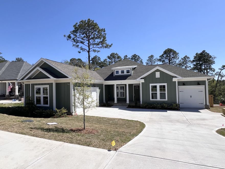 This gorgeous new home nestled on a prime lot in Deer Moss Creek features 2668 sqft with 4 bedrooms, 3.5 bathrooms, 3 car garage and a breathtaking backporch view! Beautiful bricked front and rear porches combined with sliding glass doors create an extended living area with gorgeous views of nature.The fabulous kitchen boasts a large kitchen island with a white farmhouse sink, GE  appliances, and a spacious dining area with a relaxing view of the woods. The master bedroom also has the beautiful view of the woods and the master bathroom has double vanities, a soaker tub, a walk in tile shower and a huge wood shelving master closet.