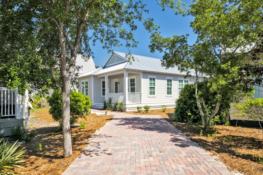 Your next move can be next level in this nearly new three-bed, two-bath home only three blocks to the sand in Seagrove Beach. The Seagrove Beach Cottages neighborhood on Scenic Highway 30A features a community pool and communal grilling area positioned in a quaint neighborhood. Completed in early 2021 and professionally decorated inside, it features a king owner's suite and queen and twin bunks in the second and third bedrooms, respectively. Rental-ready with projections of nearly $70,000 in rental income, this beach cottage is within walking distance to 30A favorites like Cafe Thirty-A and Angelina's Pizzeria & Pasta. Seagrove Beach is conveniently located near the shops, restaurants and attractions residents and vacationer.