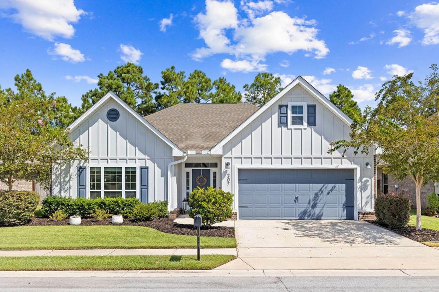Discover the perfect blend of modern updates and coastal charm at 207 Lullaby Loop, located in the desirable short-term rental-restricted neighborhood of Whispering Lake in Santa Rosa Beach. This inviting residence offers a freshly painted exterior and boasts three bedrooms, two bathrooms, and 1,823 square feet of thoughtfully designed living space. As you enter, you'll be greeted by an elegant entryway featuring stylish board and batten accents and newly installed LVP flooring that set the tone for the rest of the home. The open-concept living area is warm and welcoming with a newly added fireplace and built-in storage, highlighted by natural light that enhances the home's inviting atmosphere. The beautifully renovated kitchen is a chef's dream, showcasing sleek backsplash tile, custom hood and an extended peninsula with waterfall quartz countertops. It seamlessly connects to the open dining and living areas, making it ideal for both daily living and entertaining. The master suite is a serene retreat, complete with a custom-designed closet that provides ample storage and organization. The en-suite bathroom offers a relaxing space with dual vanities, a soaking tub and walk-in shower. Two additional guest suites, one with vaulted ceilings, share a full renovated bathroom. Outside, enjoy the tranquility of your large backyard with wooded views, which is fully fenced for added privacy. The screened-in back porch extends your living space outdoors, providing a perfect spot for morning coffee, evening relaxation, or alfresco dining. Located in the peaceful Whispering Lake community, you'll appreciate the sense of community and the convenience of nearby amenities including nearby shopping and dining of Grand Boulevard and Silver Sands Premium Outlets along with the beaches, shopping and dining of Scenic Highway 30A.