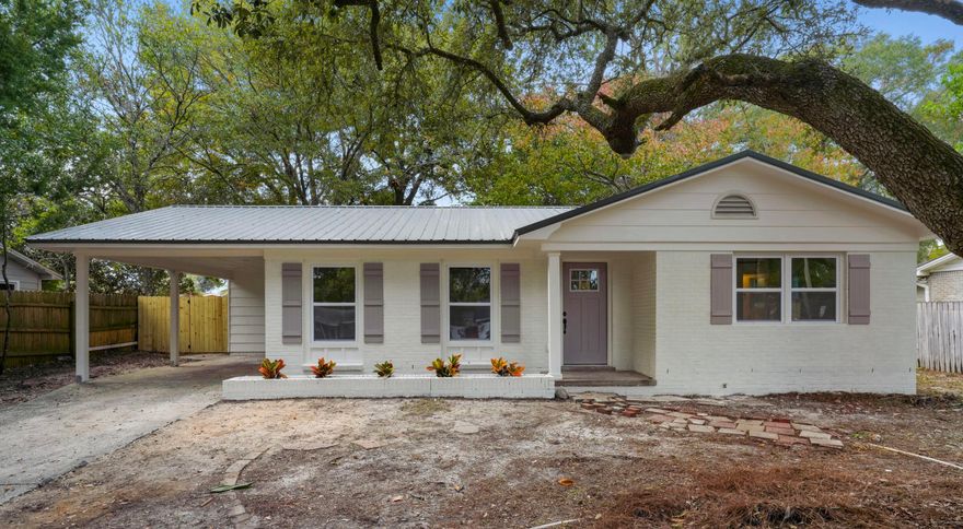 **NEW METAL ROOF, NEW HVAC AND DUCTING, NEW WATER HEATER, NEW WINDOWS, AND NEW ELECTRICAL WIRING!!**  Welcome in to this beautifully renovated 3 BR/1.5 BA home boasting beautiful, modern coastal finishes throughout. This home has been upgraded from top to bottom with floor to ceiling paint, updated kitchen and baths, LVP flooring, recessed lighting, 6-panel doors, all new trim and 1x4 baseboard, custom closet shelving, and modern matte black door hardware throughout. Walking into the home, you will be greeted by an open living, dining, and kitchen with tons of natural lighting and contemporary charm. The custom accent wall in the living room provides a modern flair and sophistication. Moving thru the home, the details don't stop there!