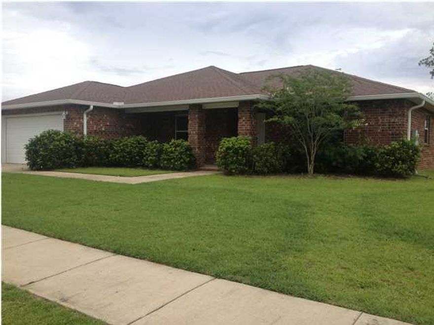 Stunning 3 bedroom/2 bath all brick home with mature landscaping, sidewalks and a grand porch entrance! NOT A SHORT SALE!! Wide foyer boasts double glass inset french doors that lead to an oversized office/bonus room on one side and spacious dining area on the other. The dining space connects to an open floor plan kitchen/living area. Along with plenty of cabinet space, the kitchen features a massive double door pantry, oak 42'' upper cabinets with stainless hardware, a bar for extra seating, stainless steel appliances (dishwasher, microwave, flat top stove and frig with exterior water), crown molding, can lights, decorative ledges and arched entry ways. Throughout this clean and well maintained home you will find bull nosed corners, upgraded neutral carpeting, neutral paint,